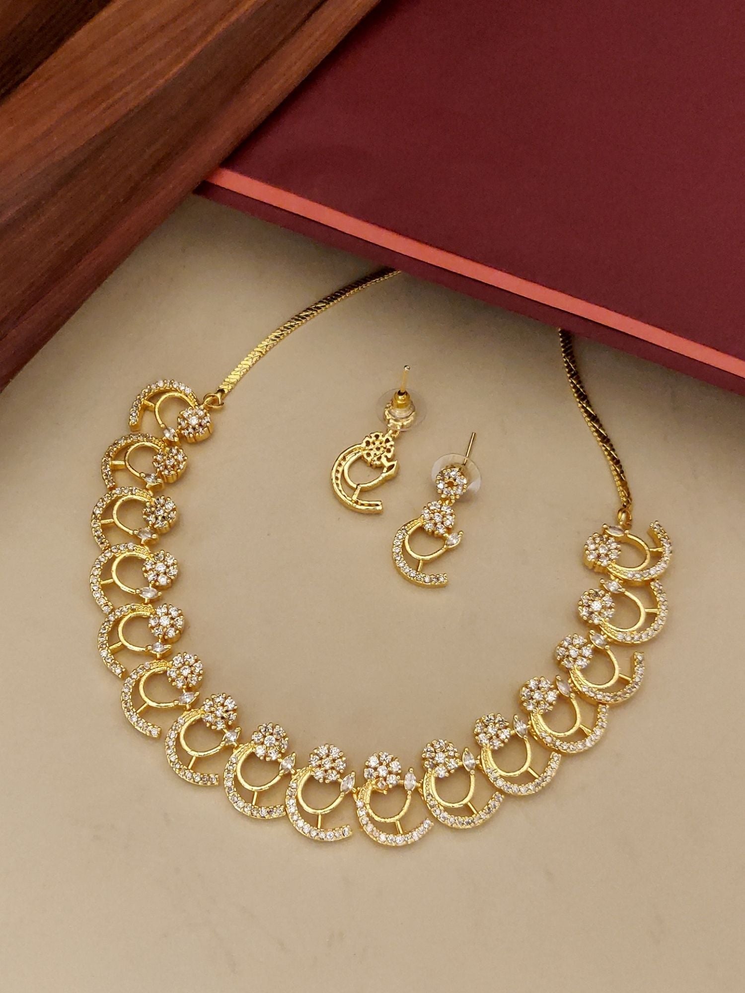 Abdesignsjewellery gold tone American diamond necklace set with floral crystal motifs and matching earrings