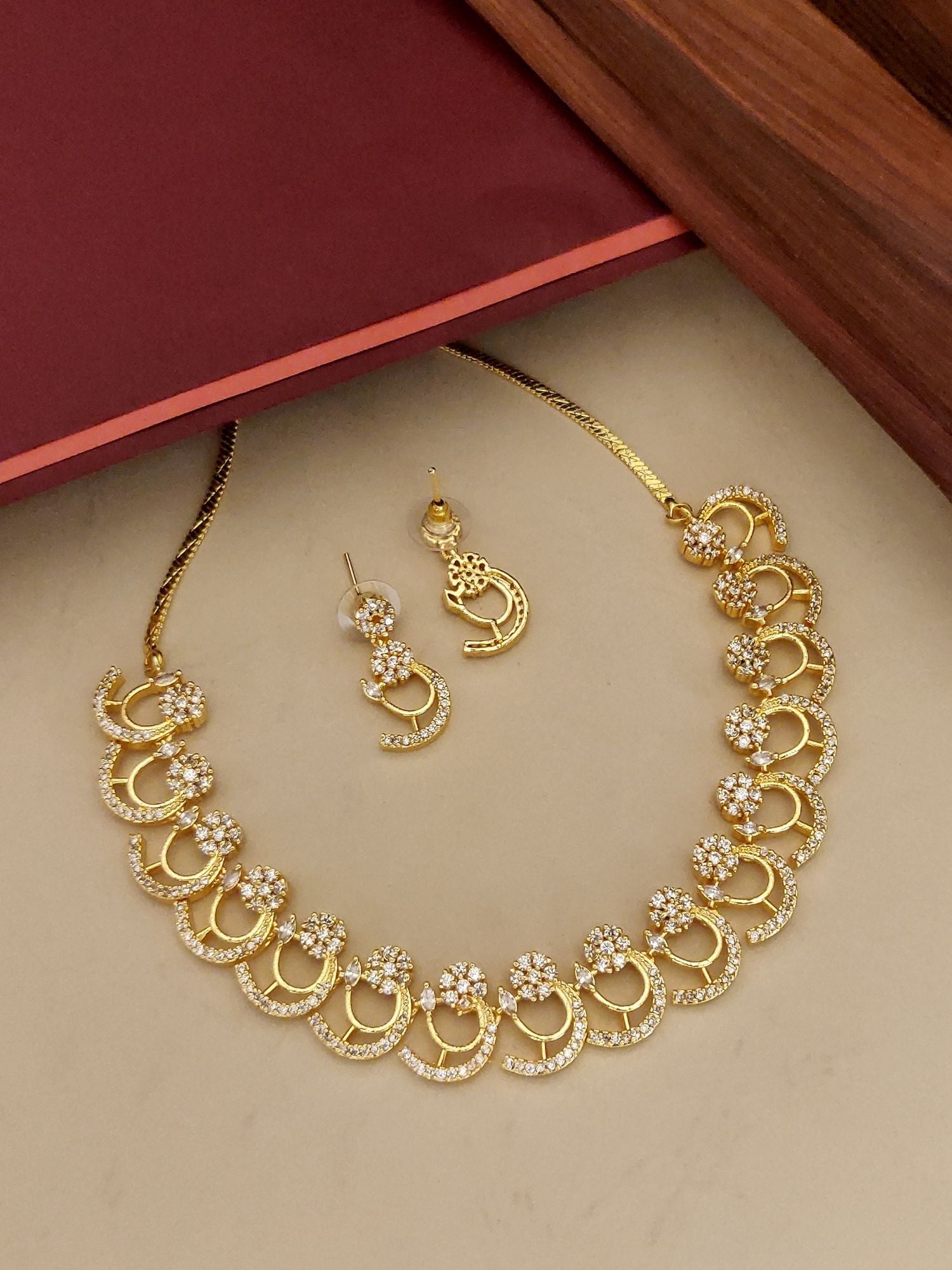 Abdesignsjewellery gold pendant chain with crescent floral motifs and matching drop earrings American diamond necklace set