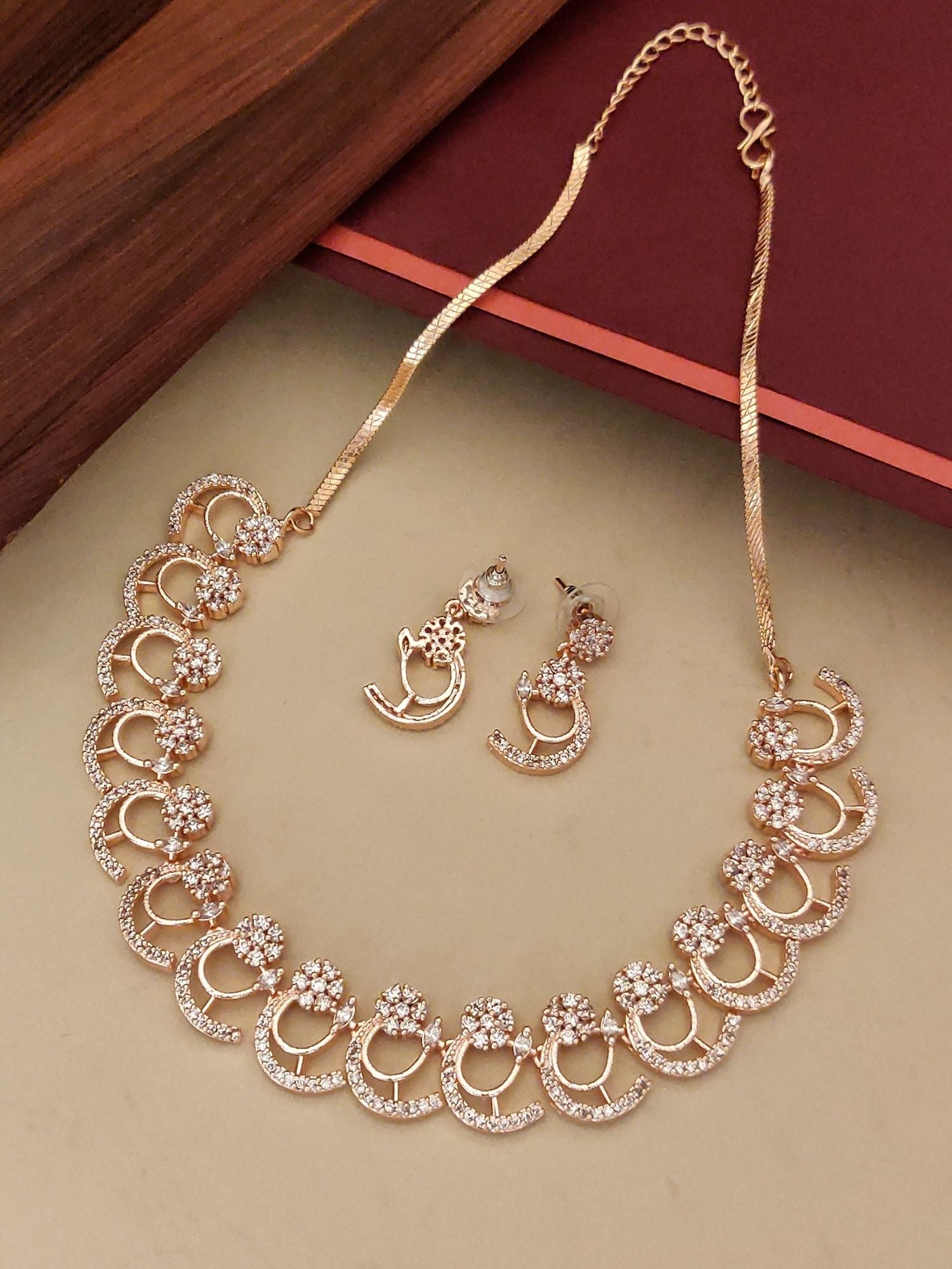 Abdesignsjewellery gold tone American diamond necklace set with floral circular motifs and matching earrings