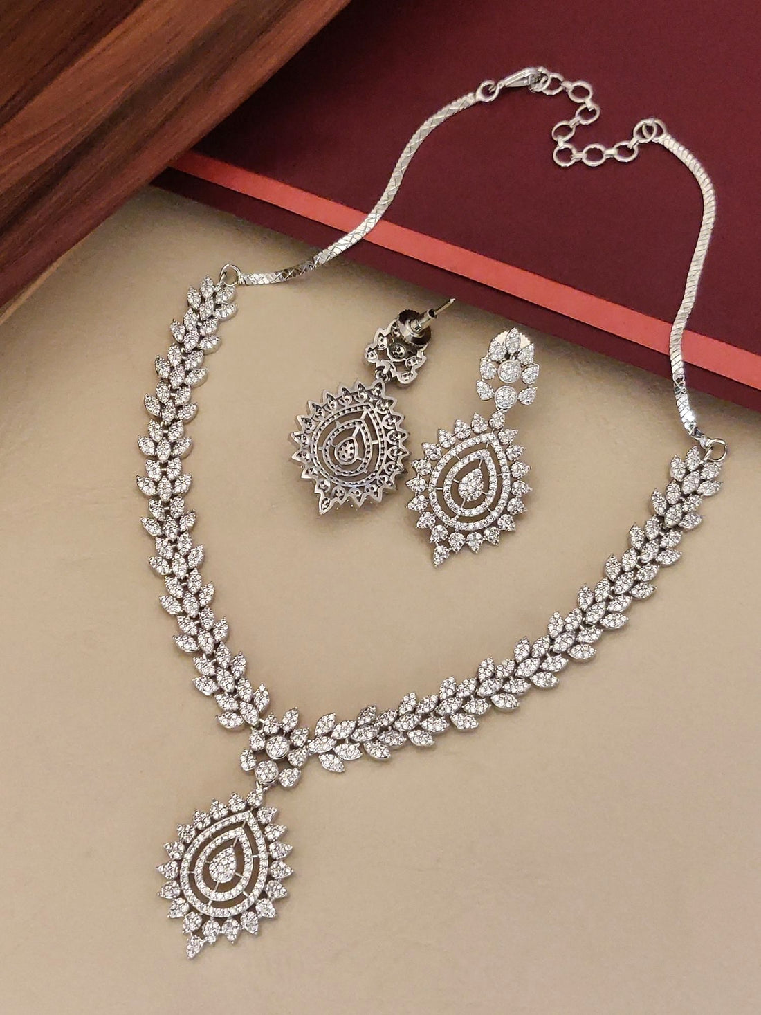 Elegant American Diamond Necklace Set with intricate leaf design and matching earrings for special occasions