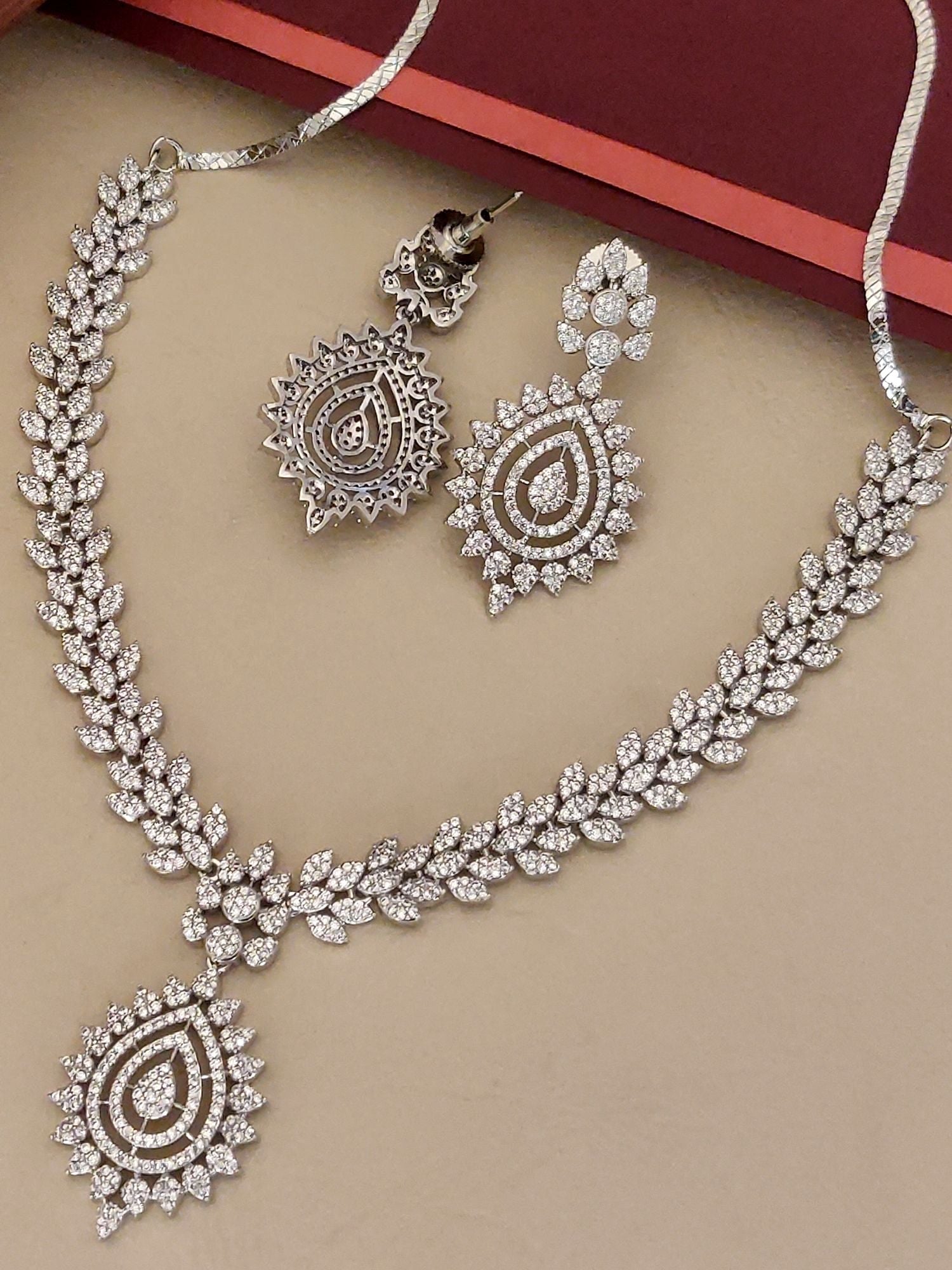 Stunning American Diamond Necklace Set with intricate leaf designs and matching earrings for elegant occasions