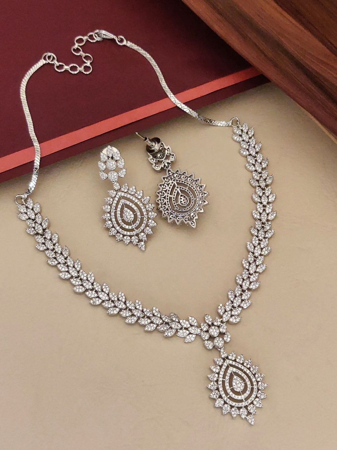 Elegant American Diamond Necklace Set with intricate leaf design and matching earrings for special occasions