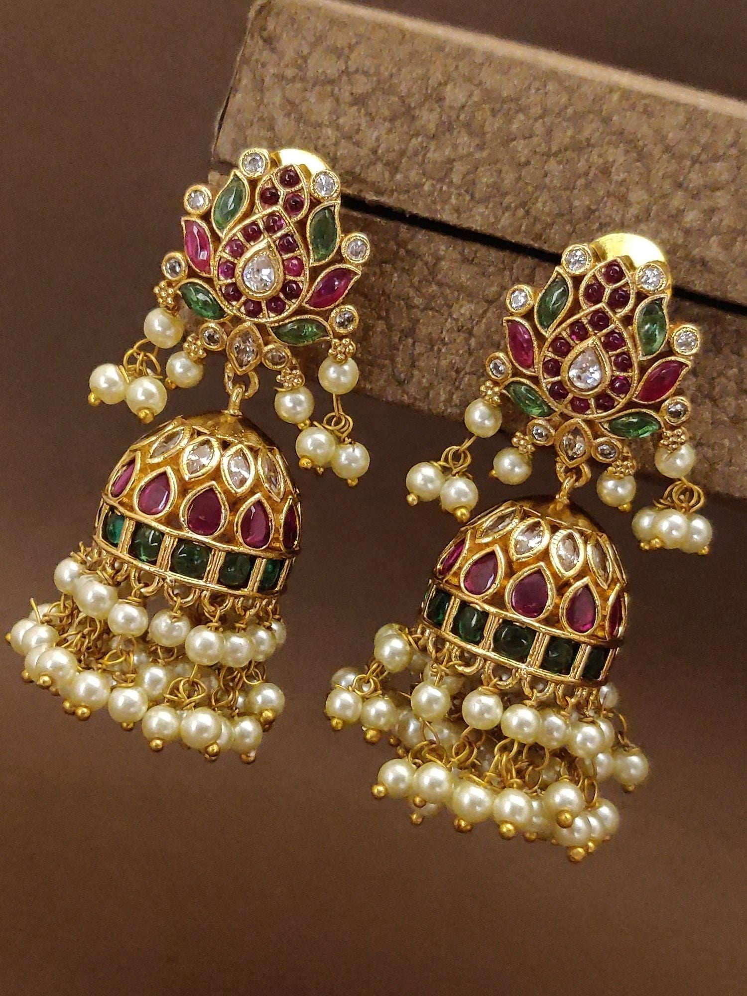 Antique Gold Plated Jhumka Earrings adorned with colorful stone accents and pearl details