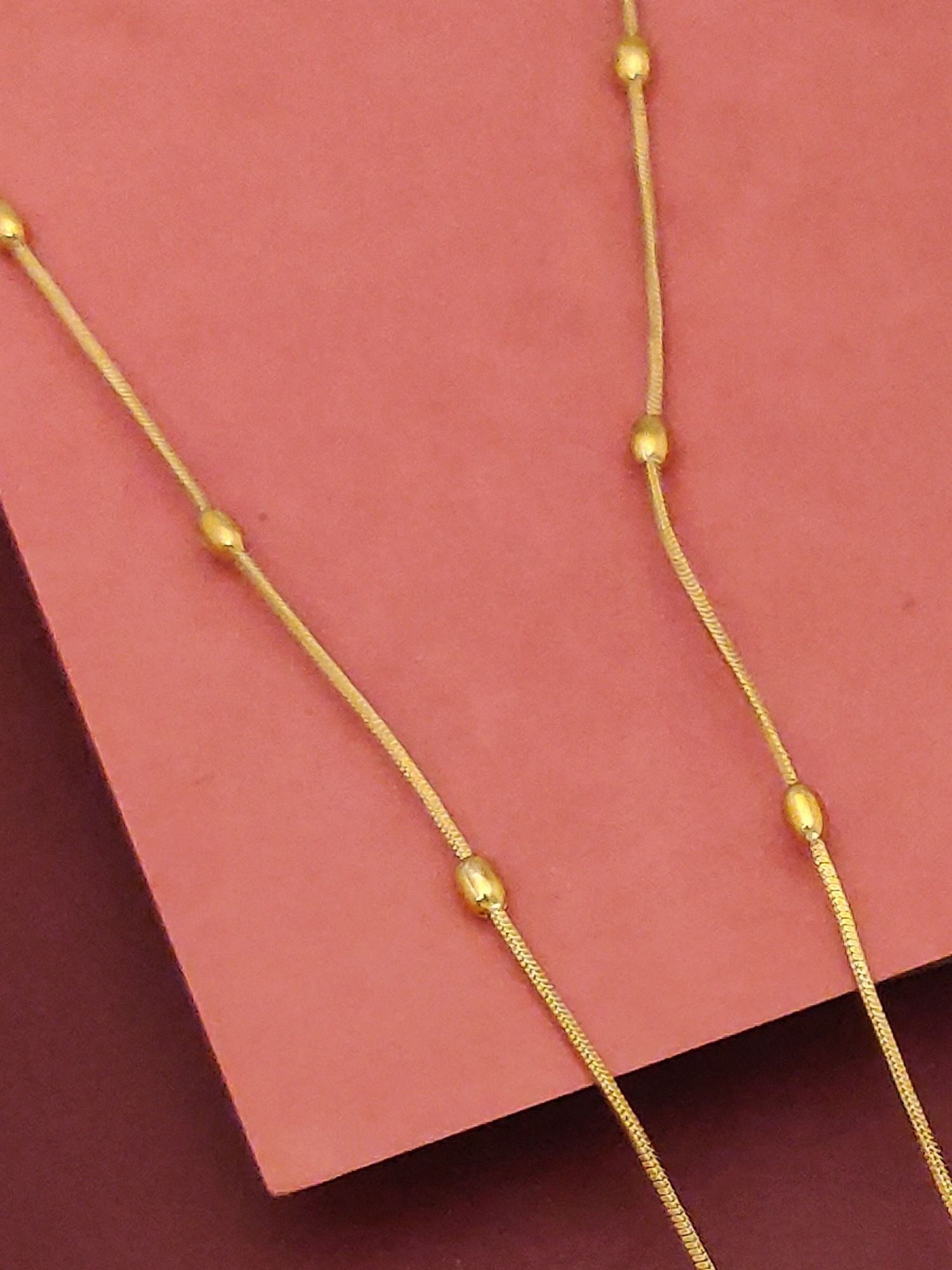 Antique Gold Plated Kempstone Beads Necklace Set by Abdesignsjewellery slim gold chain with spaced bead accents on pink background