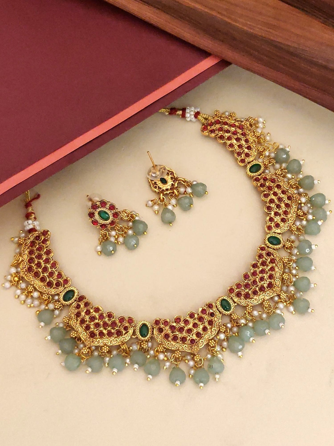 Stunning Antique Gold Plated KempStone Studed Necklace Set with intricate design and matching earrings