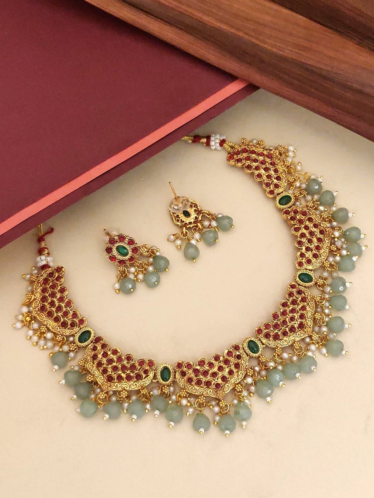 Stunning Antique Gold Plated KempStone Studed Necklace Set with intricate design and matching earrings