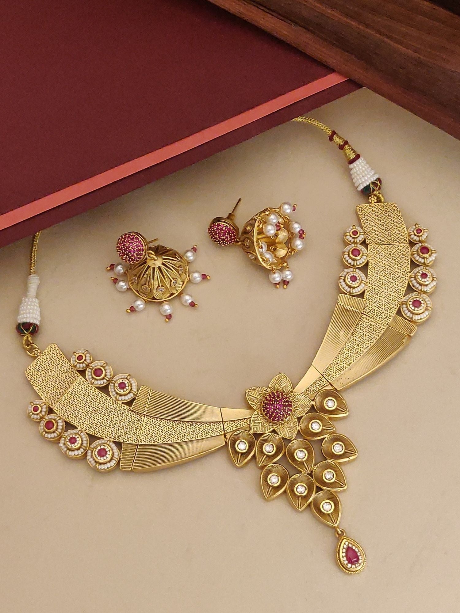 Antique Gold Plated Necklace Set featuring intricate designs and matching earrings