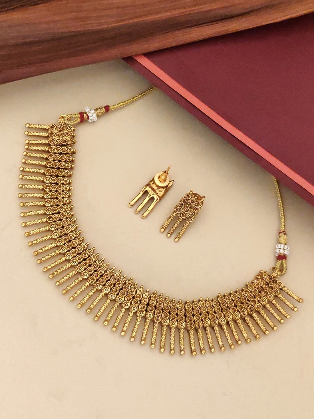 Antique Gold Plated Necklace Set with intricate design and matching earrings for festive occasions