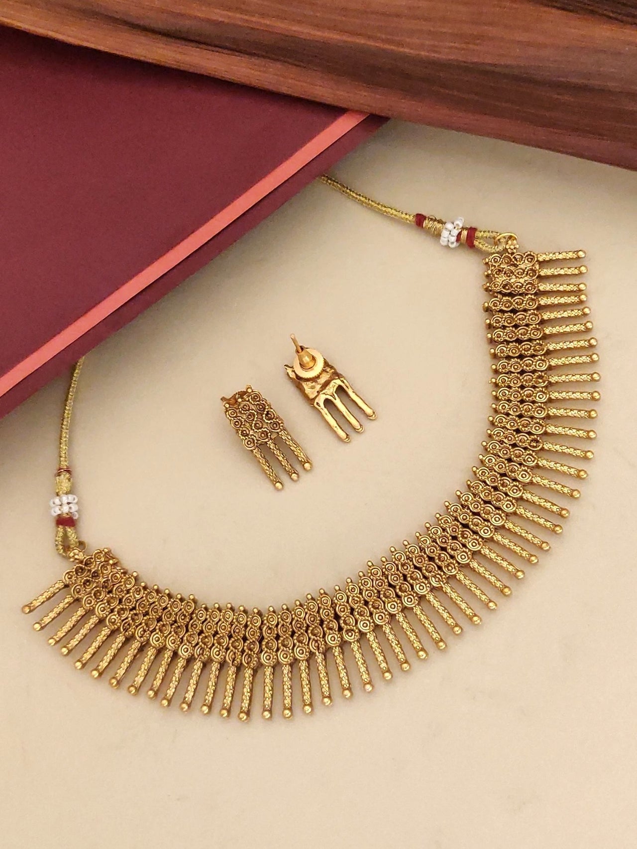 Antique Gold Plated Necklace Set with intricate design and matching earrings for festive occasions