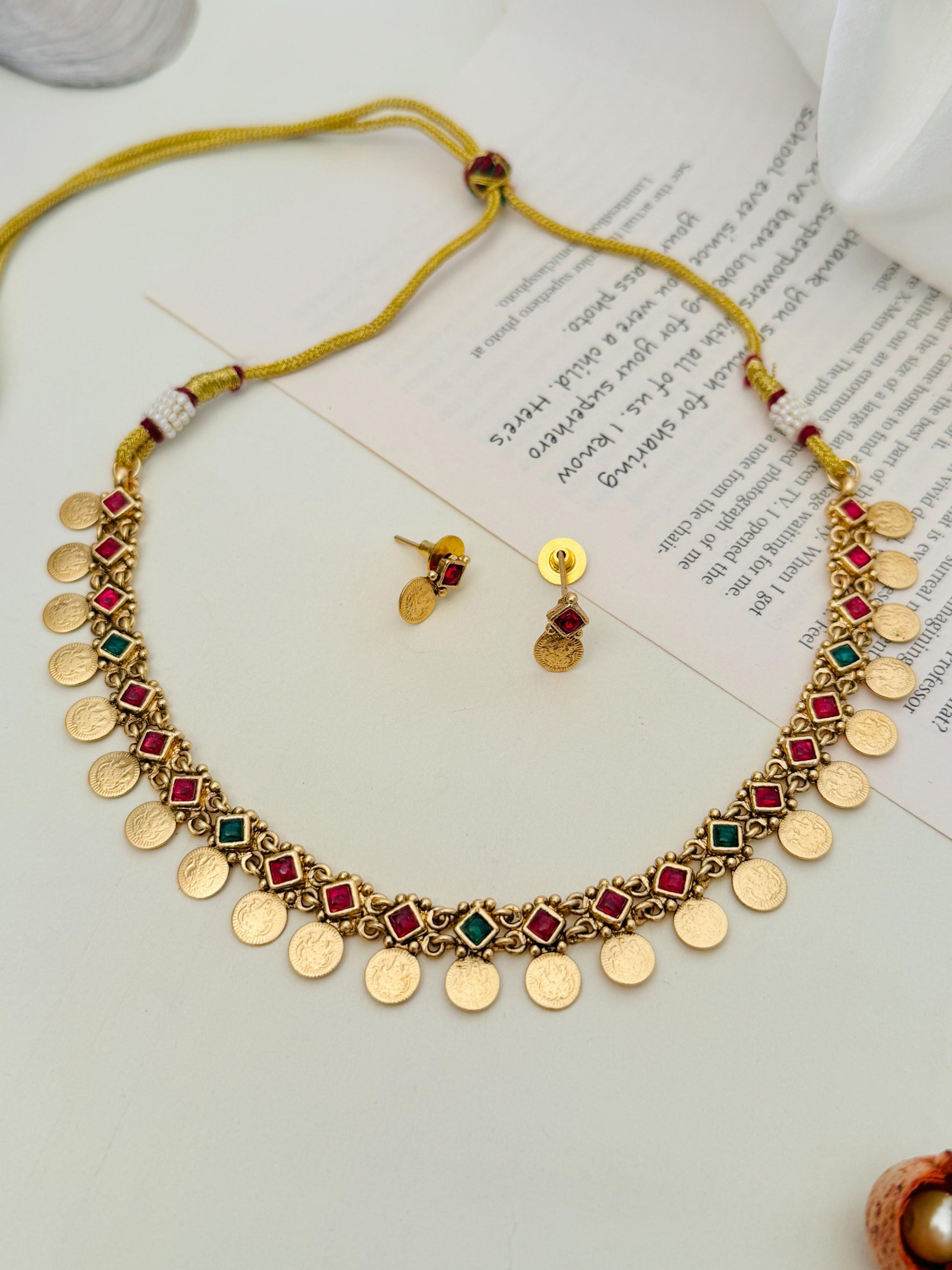 Antique Golden Plated Matt Finish Necklace Set with red and green stones and matching earrings by Abdesignsjewellery