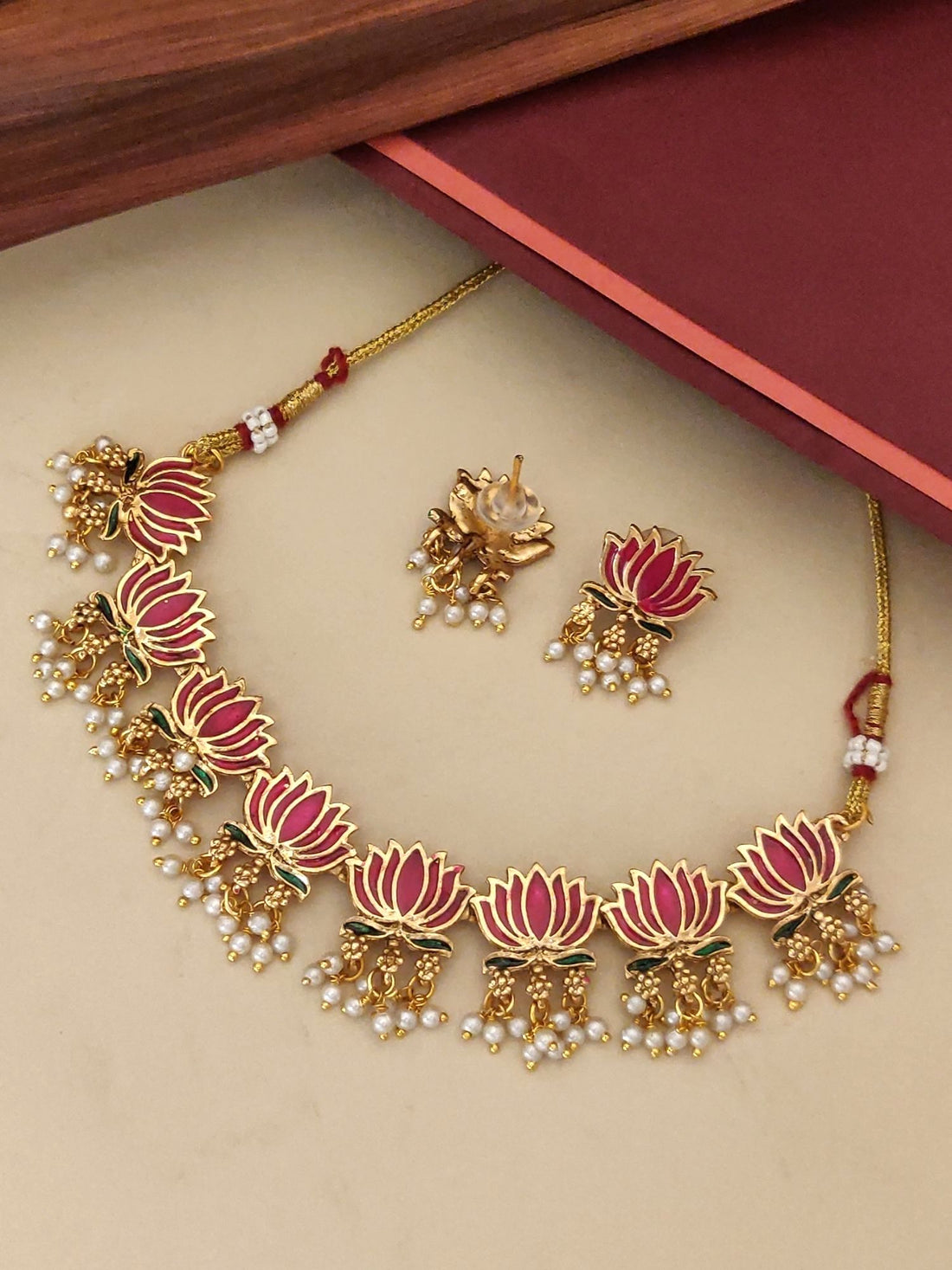 Elegant antique lotus necklace set with gold detailing and pearl accents for a traditional look
