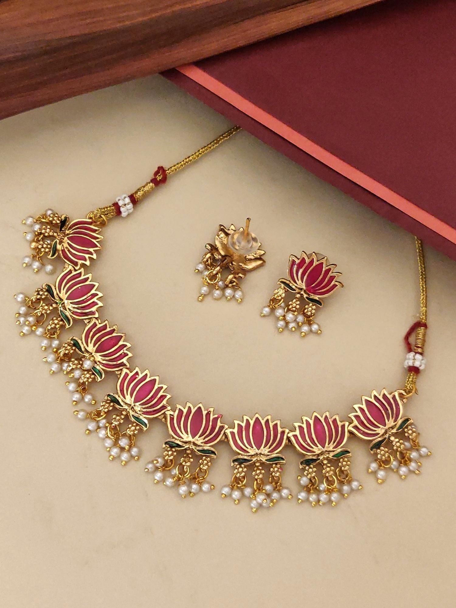 Elegant antique lotus necklace set with intricate flower designs and pearl detailing