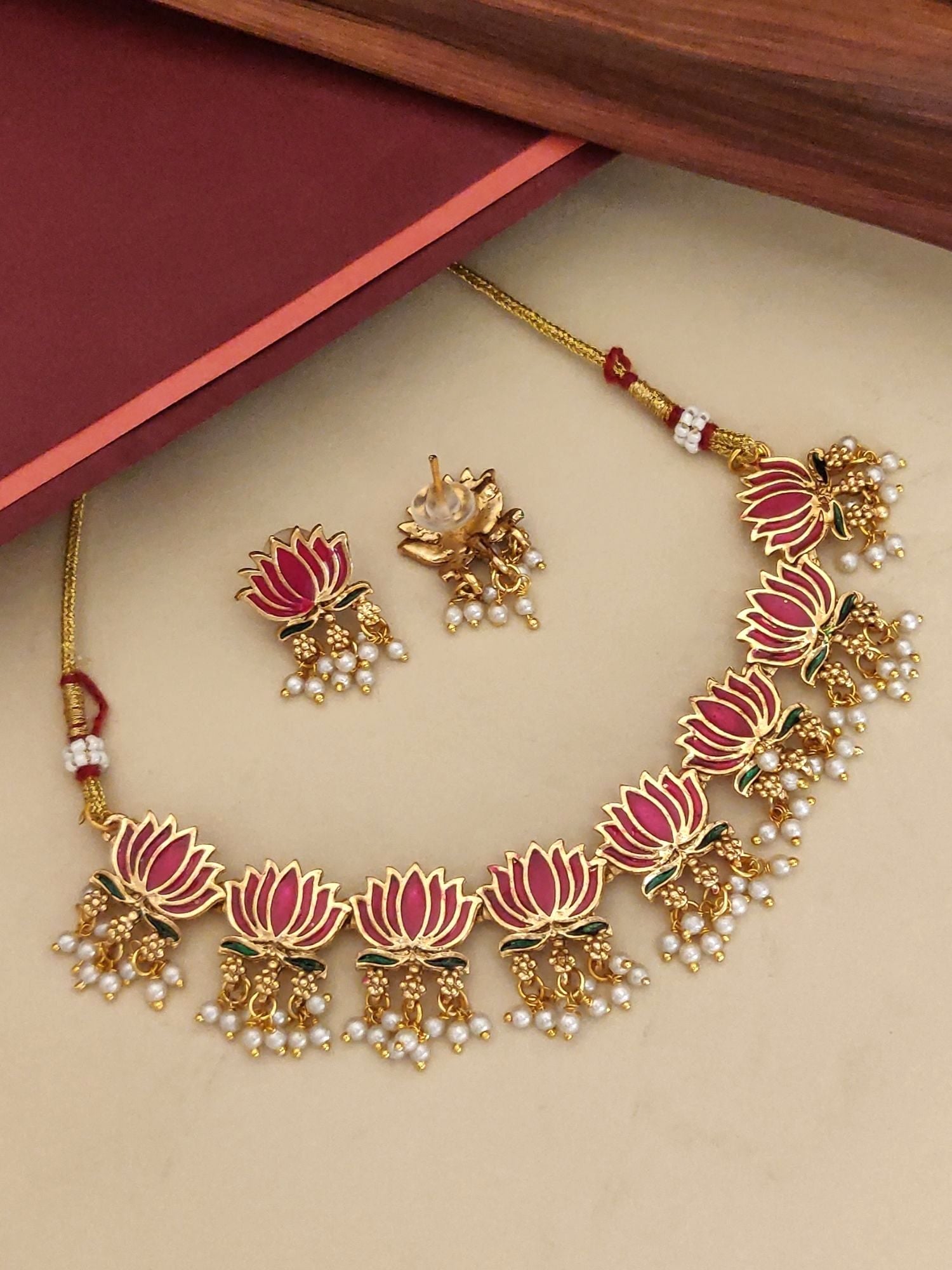 Elegant antique lotus necklace set with gold detailing and pearl accents for a traditional look