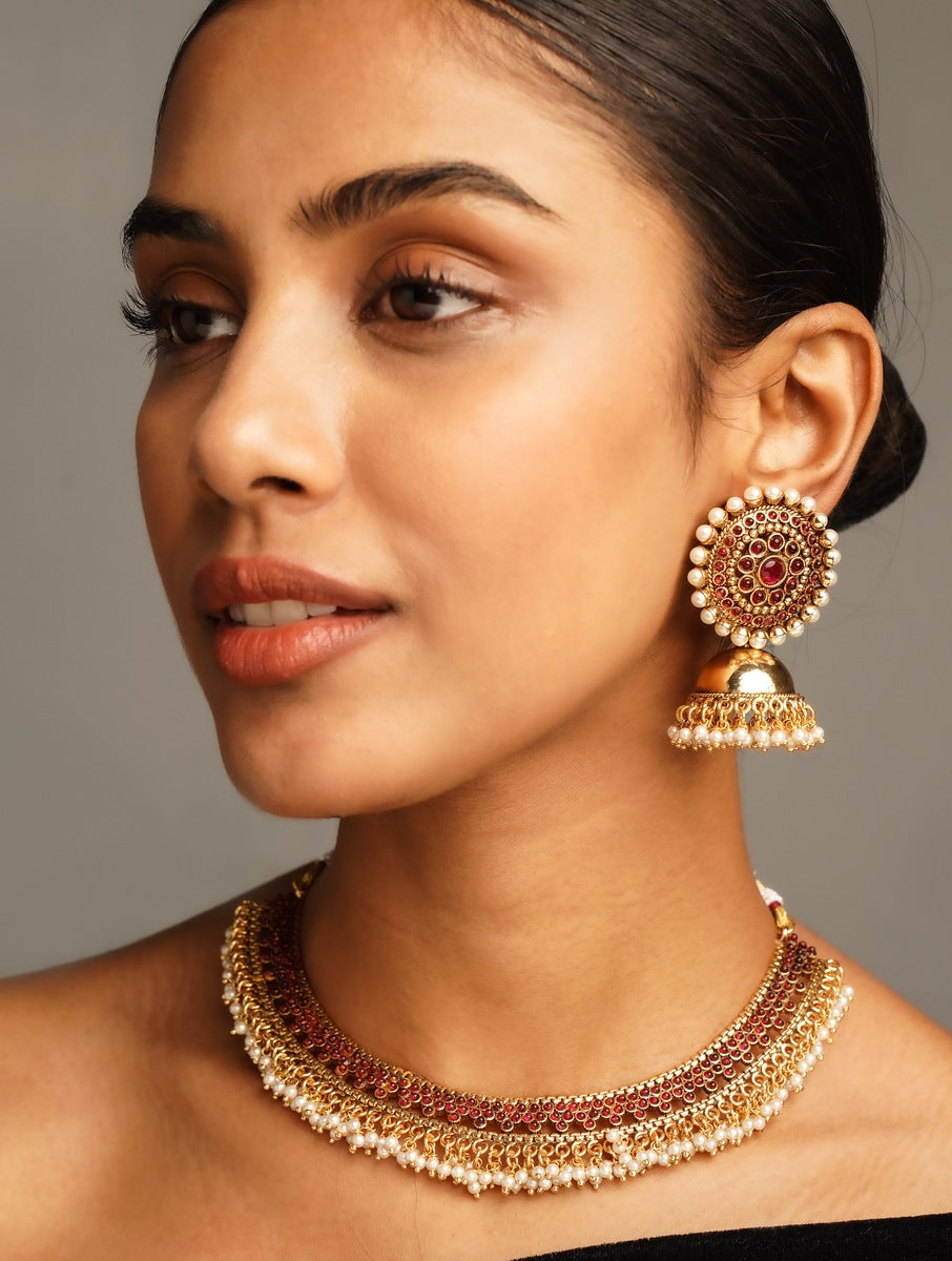 Antique Matt Gold Plated Necklace Set with intricate design and matching earrings worn by woman
