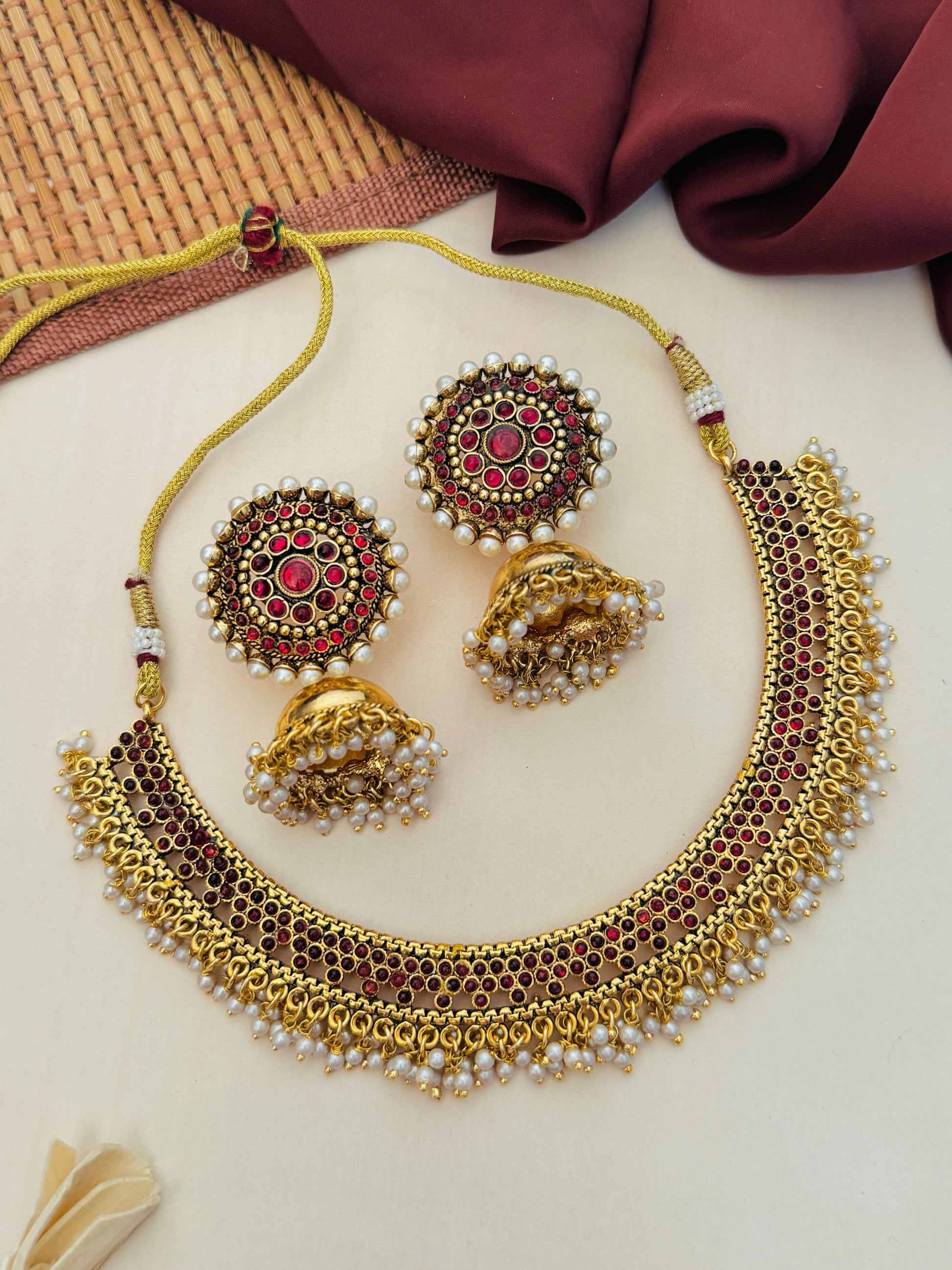Antique Matt Gold Plated Necklace Set with intricate red stone detailing and matching earrings