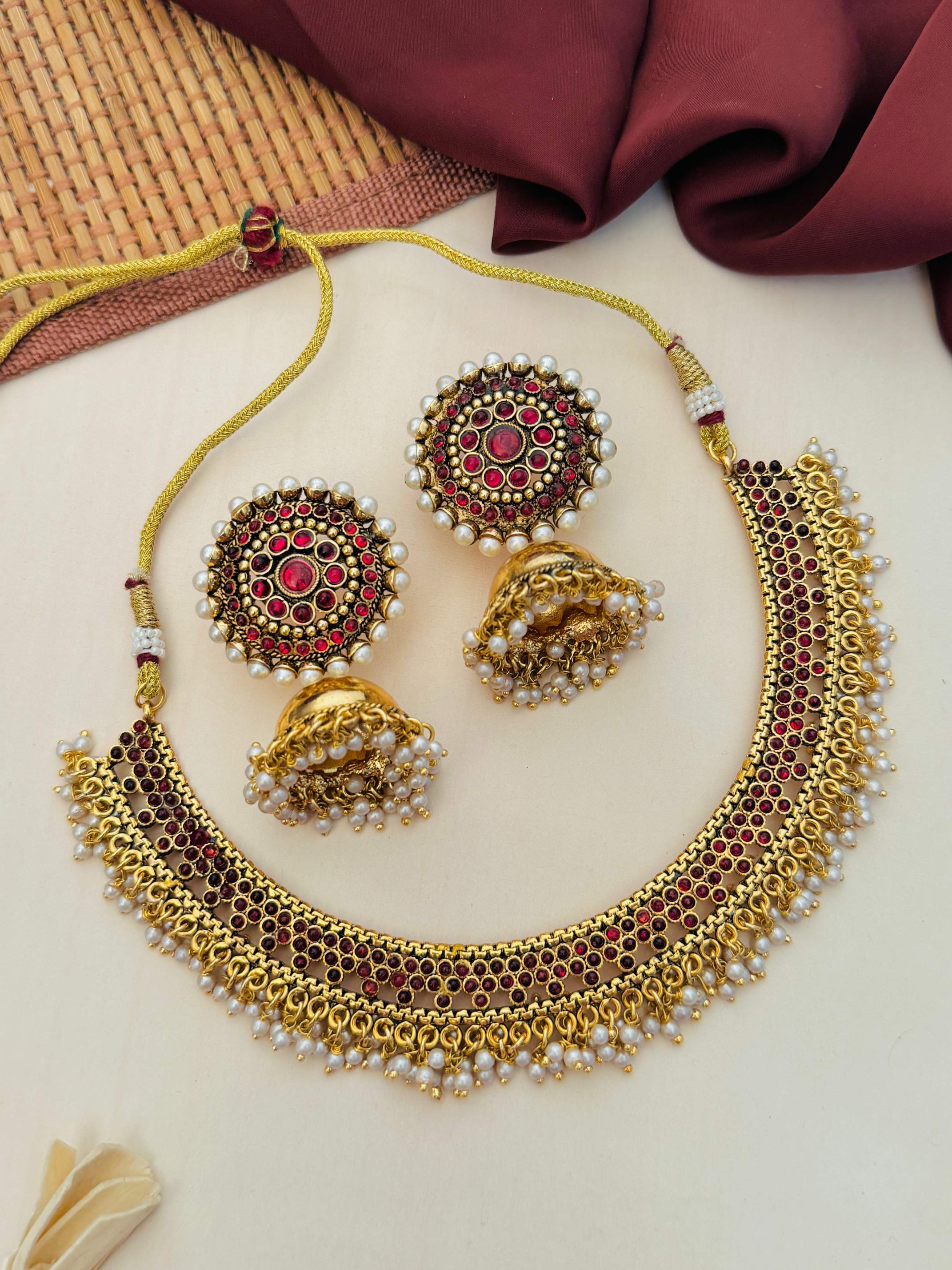 Antique Matt Gold Plated Necklace Set with intricate red stone detailing and matching earrings
