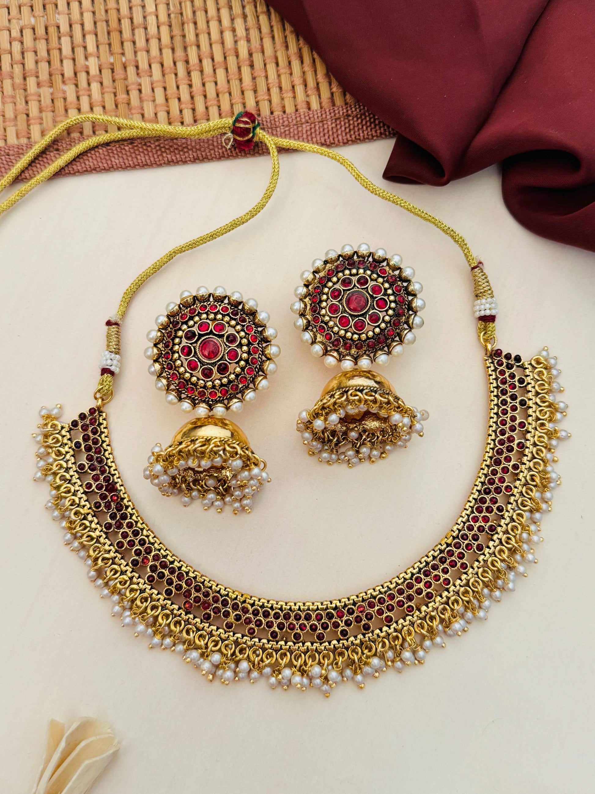 Antique Matt Gold Plated Necklace Set with red stones and pearl detailing by Abdesignsjewellery