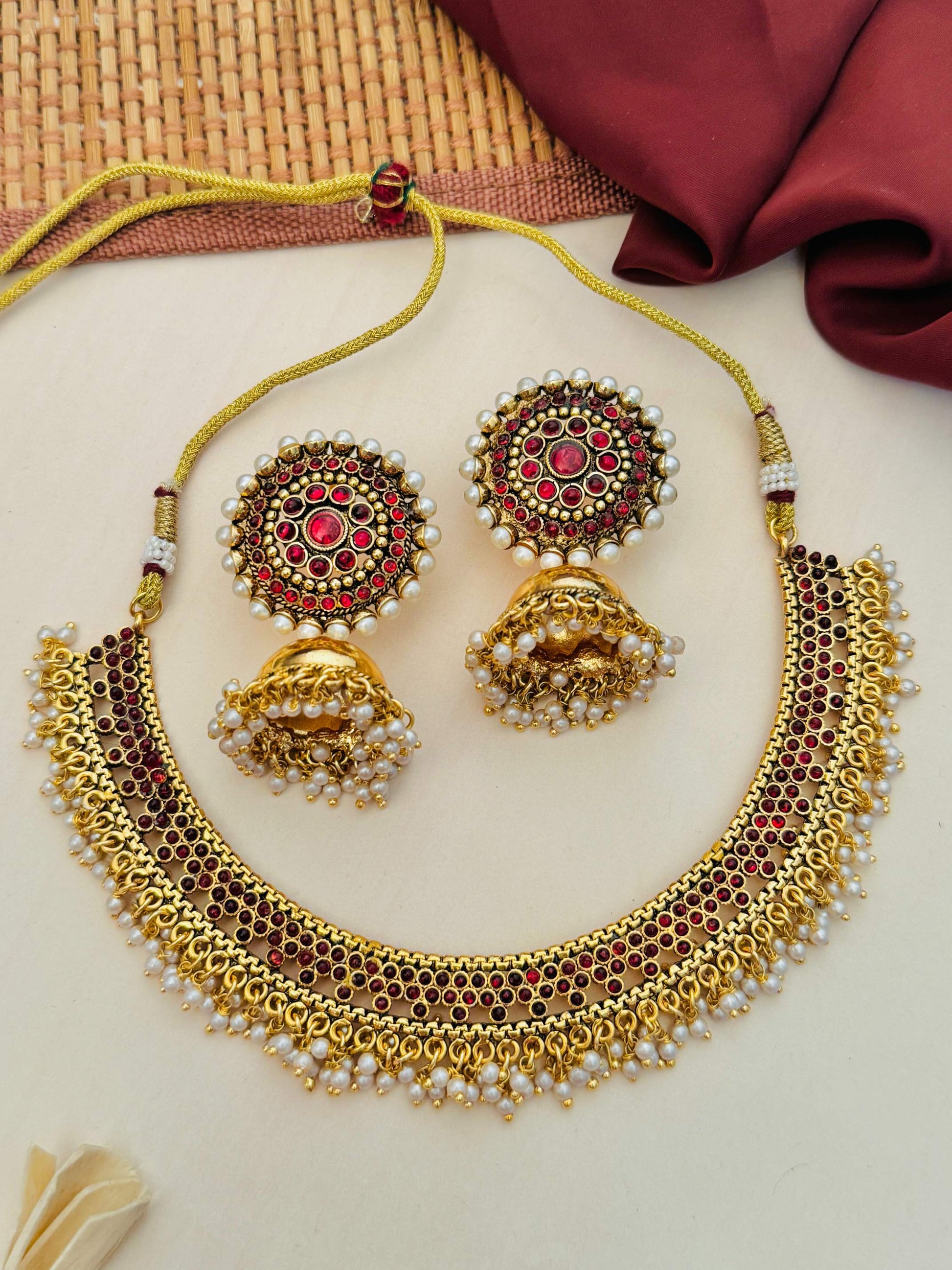 Abdesignsjewellery Antique Matt Gold Plated Necklace Set with intricate red stone and pearl detailing