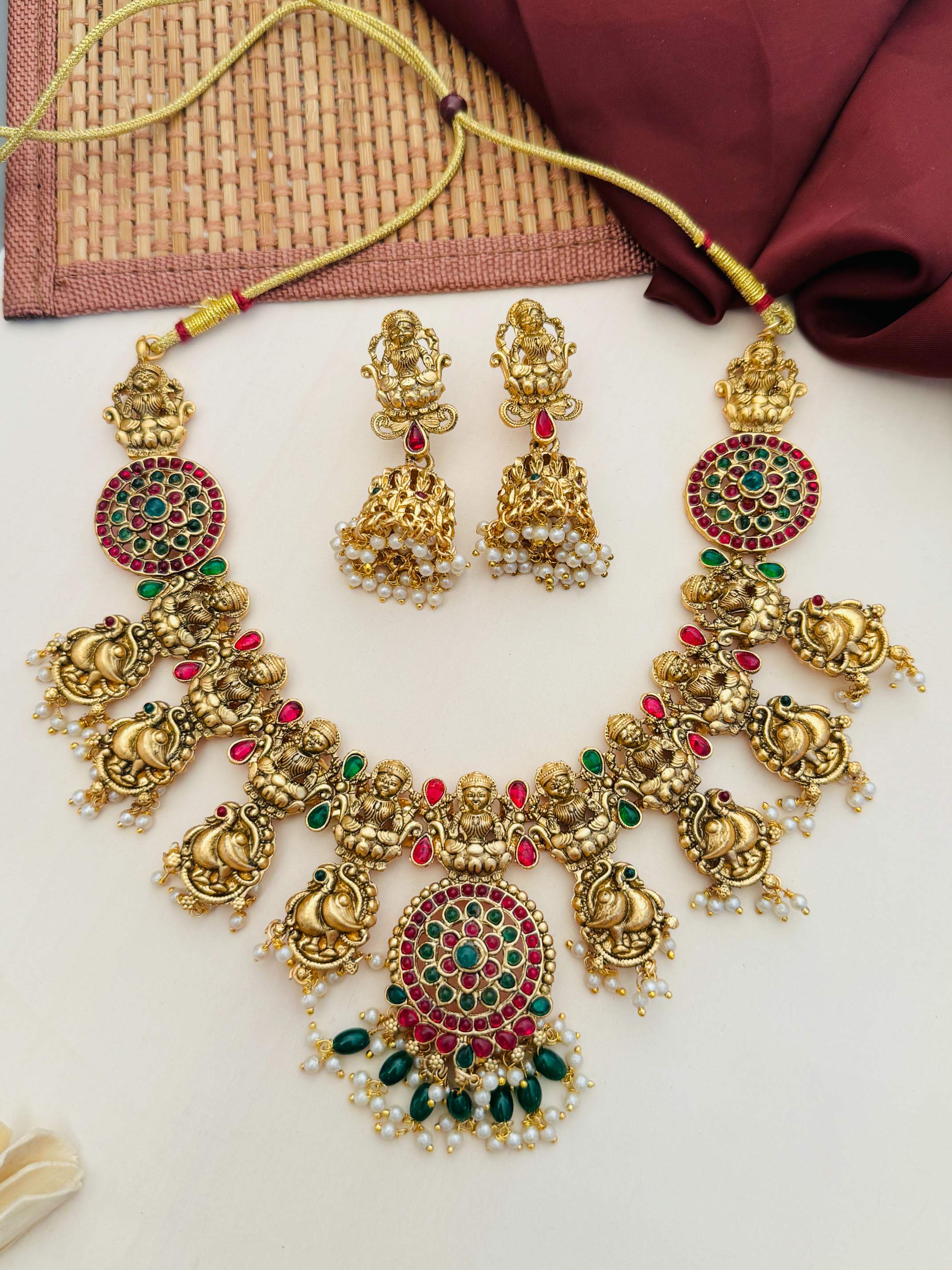 Antique Matt Gold Plated Temple Necklace Set with intricate red and green stones and pearl detailing by Abdesignsjewellery