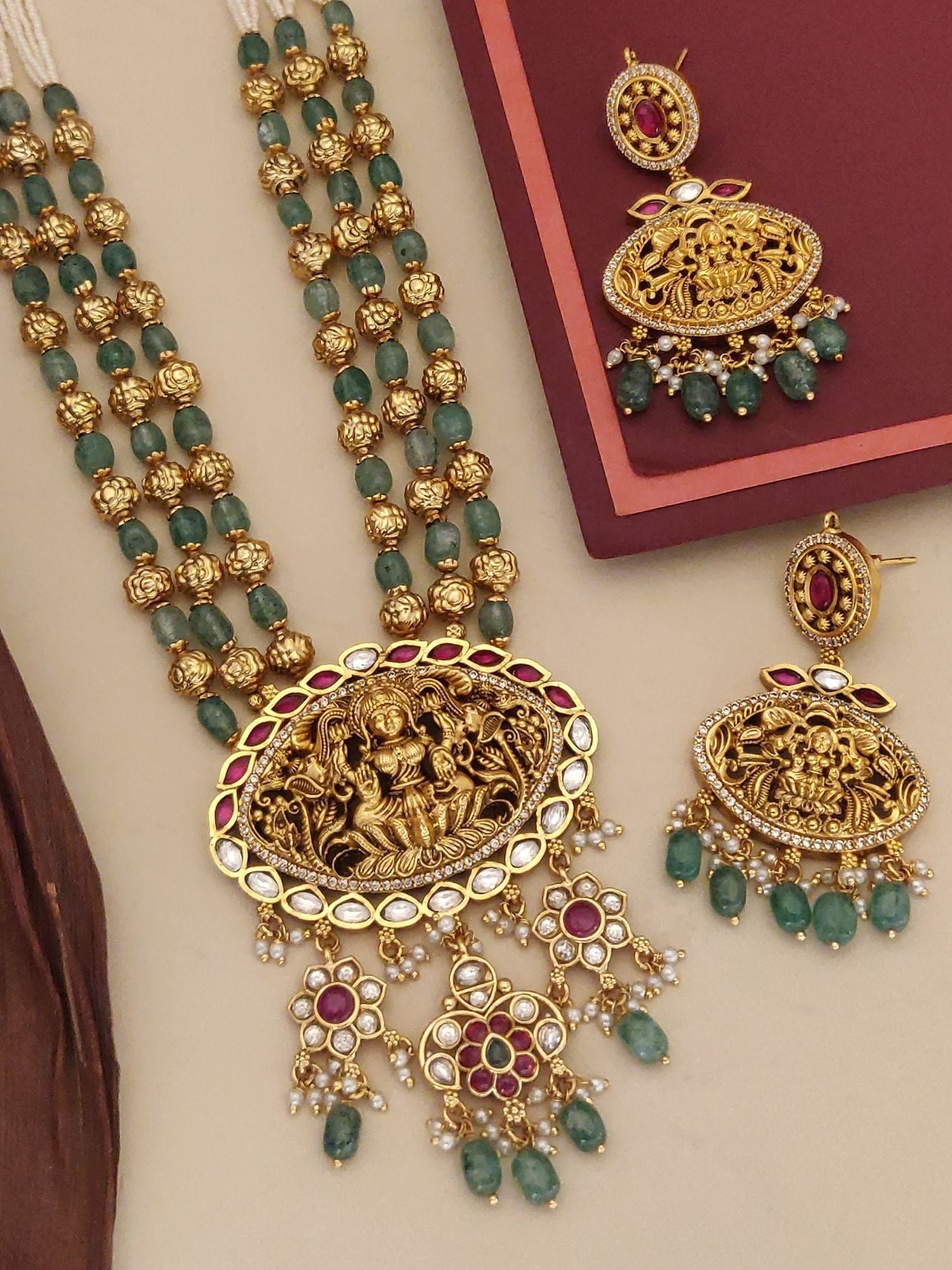 Antique Matt Gold Plated Temple Necklace Set with intricate design and green beads, featuring matching earrings