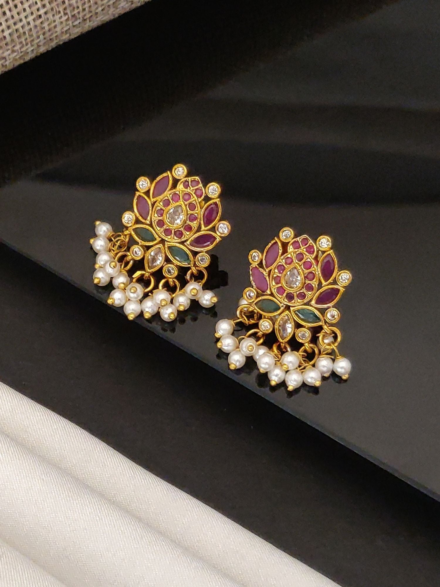 Artificial Floral gold jhumka earrings for women with pink and green enamel and pearl drops