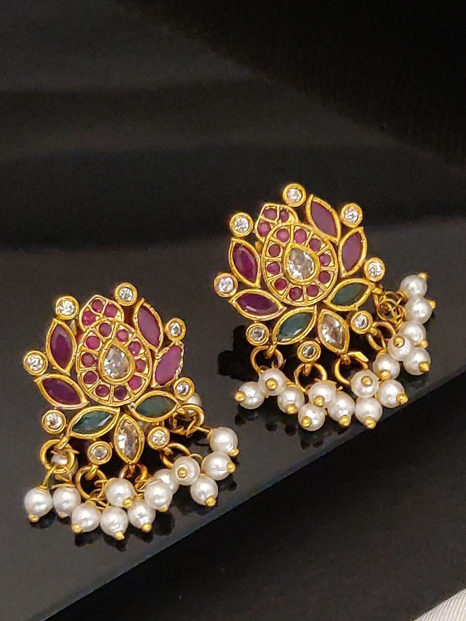 Artificial Floral gold jhumka earrings for women with purple and green enamel and pearl drops