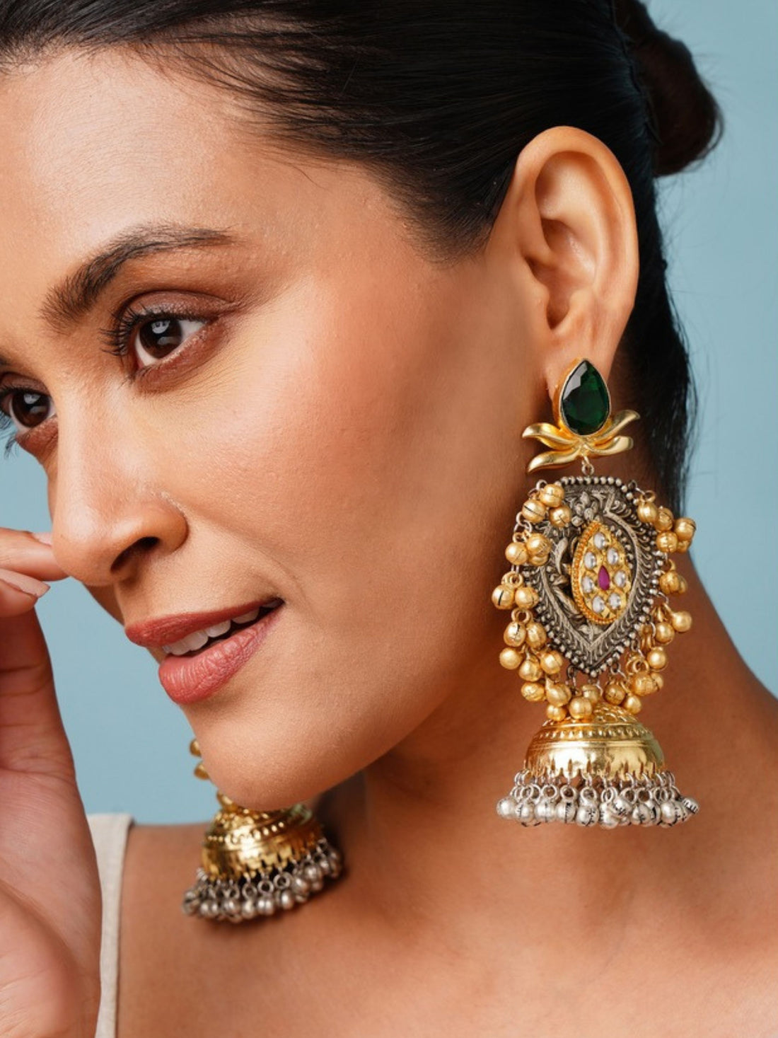 Beautiful DualTone Pachi Kundan Jhumka Earring worn by woman showcasing intricate gold and green design
