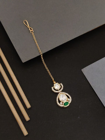 Beautiful gold plated polki maangtikka with intricate design and green gemstone by Abdesignsjewellery