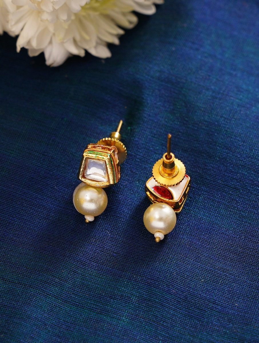 Beautiful Parrot Pearl Kundan Necklace earrings with pearl drops on blue fabric background