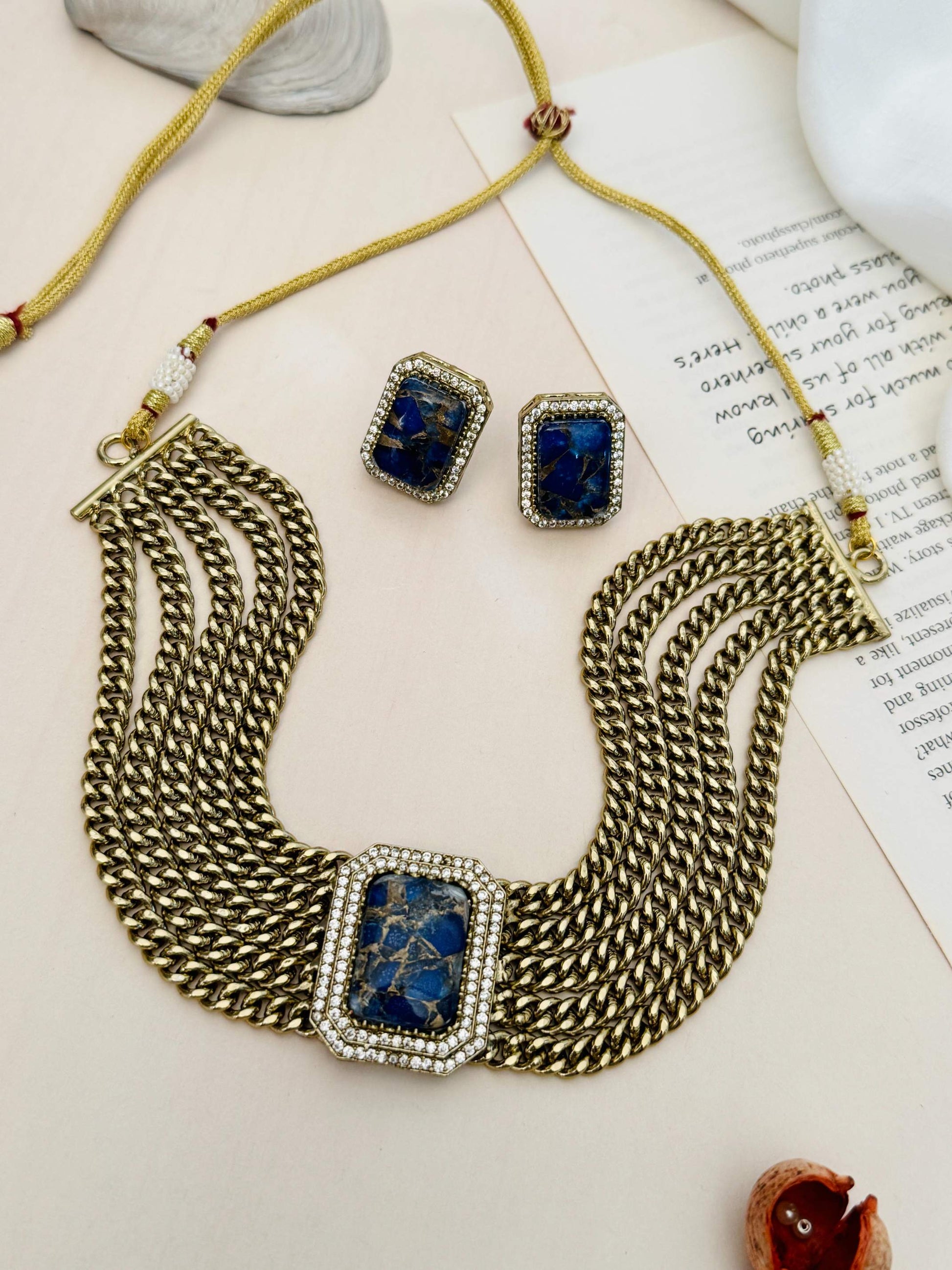 Chain Choker Necklace Set by Abdesignsjewellery with gold links and blue stone pendant with matching earrings