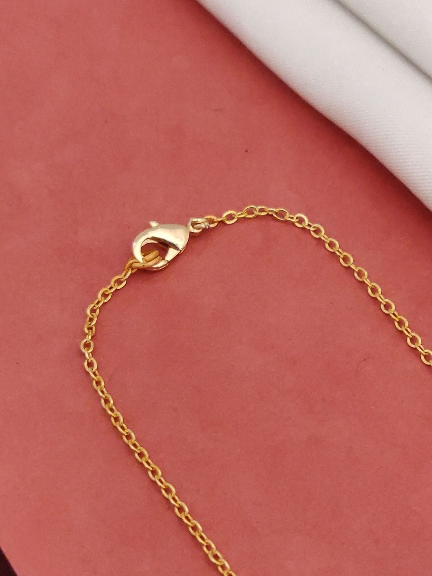 Gold chain clasp detail of a daily wear infinity necklace from Abdesignsjewellery