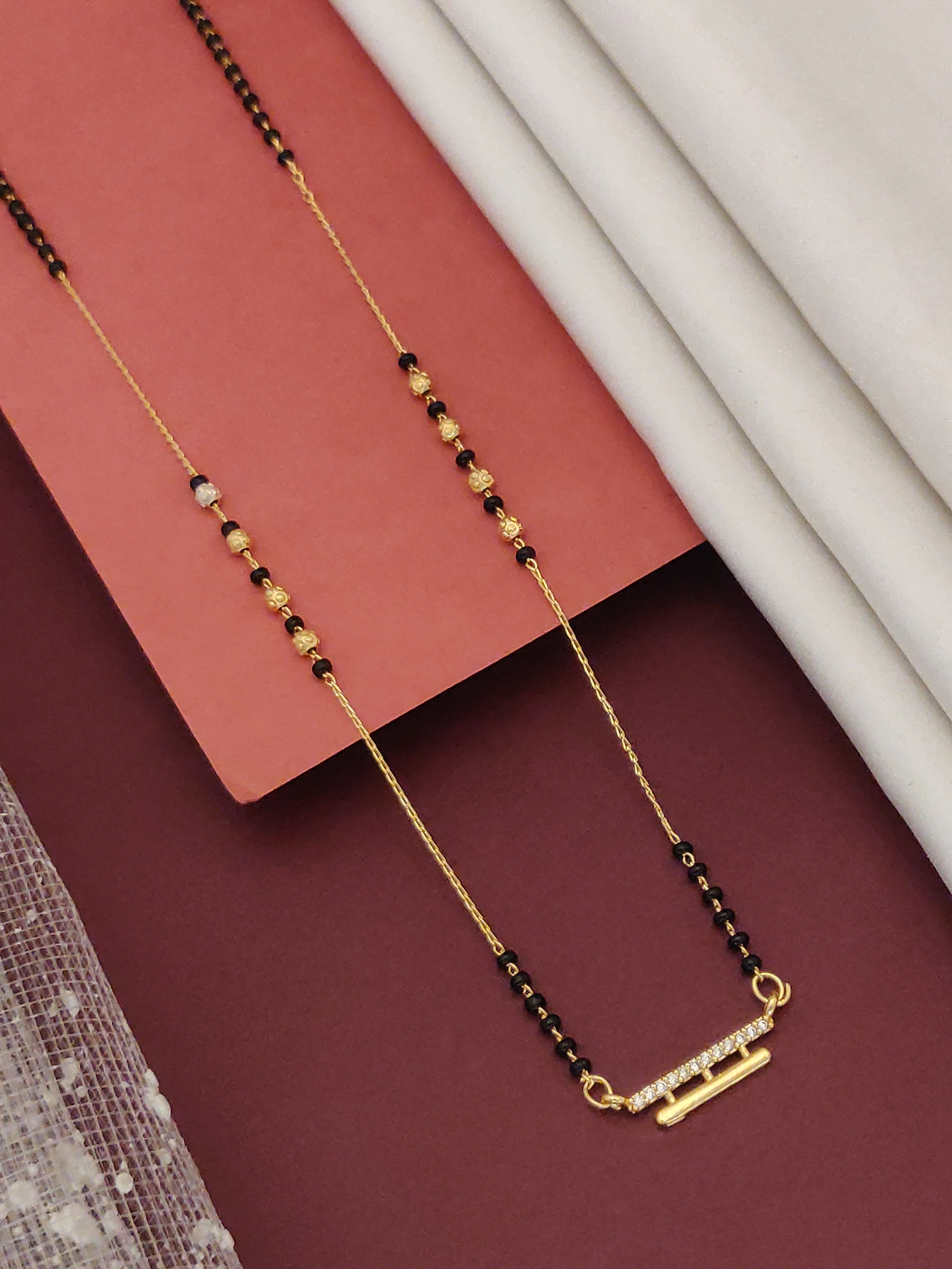 DailyWear Gold Plated American Diamond Mangalsutra with elegant black beads and gold accents