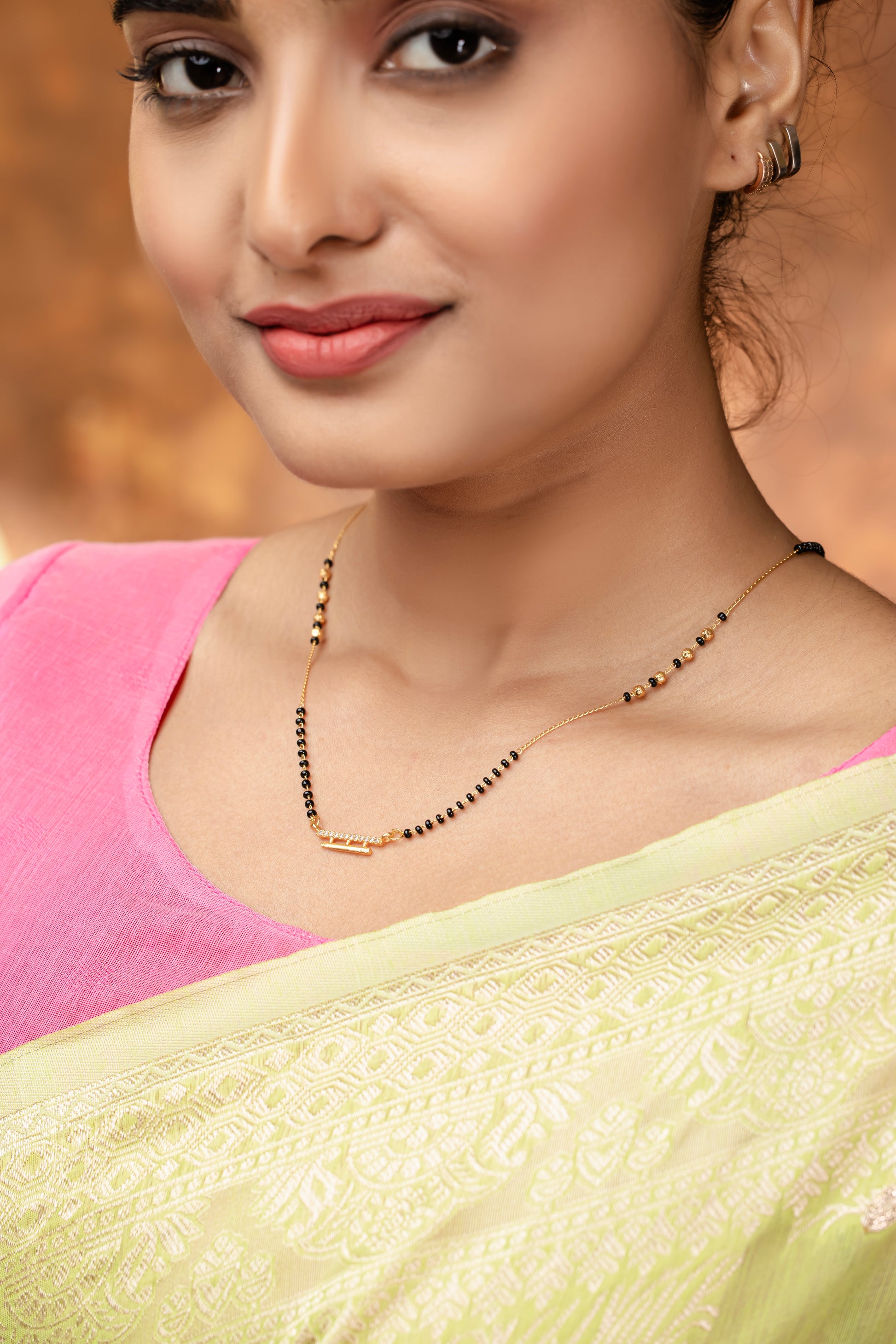 Elegant DailyWear Gold Plated American Diamond Mangalsutra showcased on a model wearing a saree