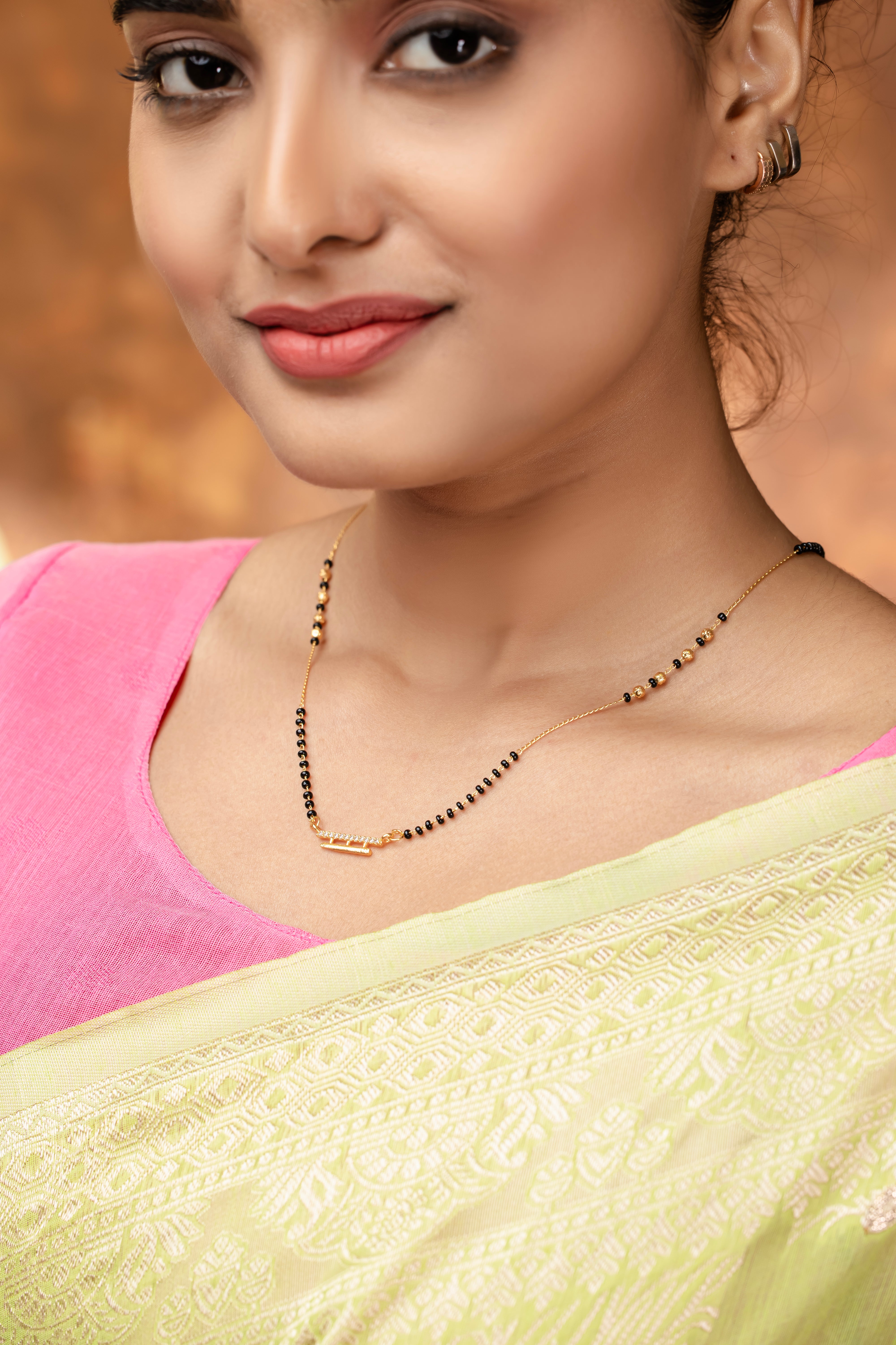 Elegant DailyWear Gold Plated American Diamond Mangalsutra showcased on a model wearing a saree