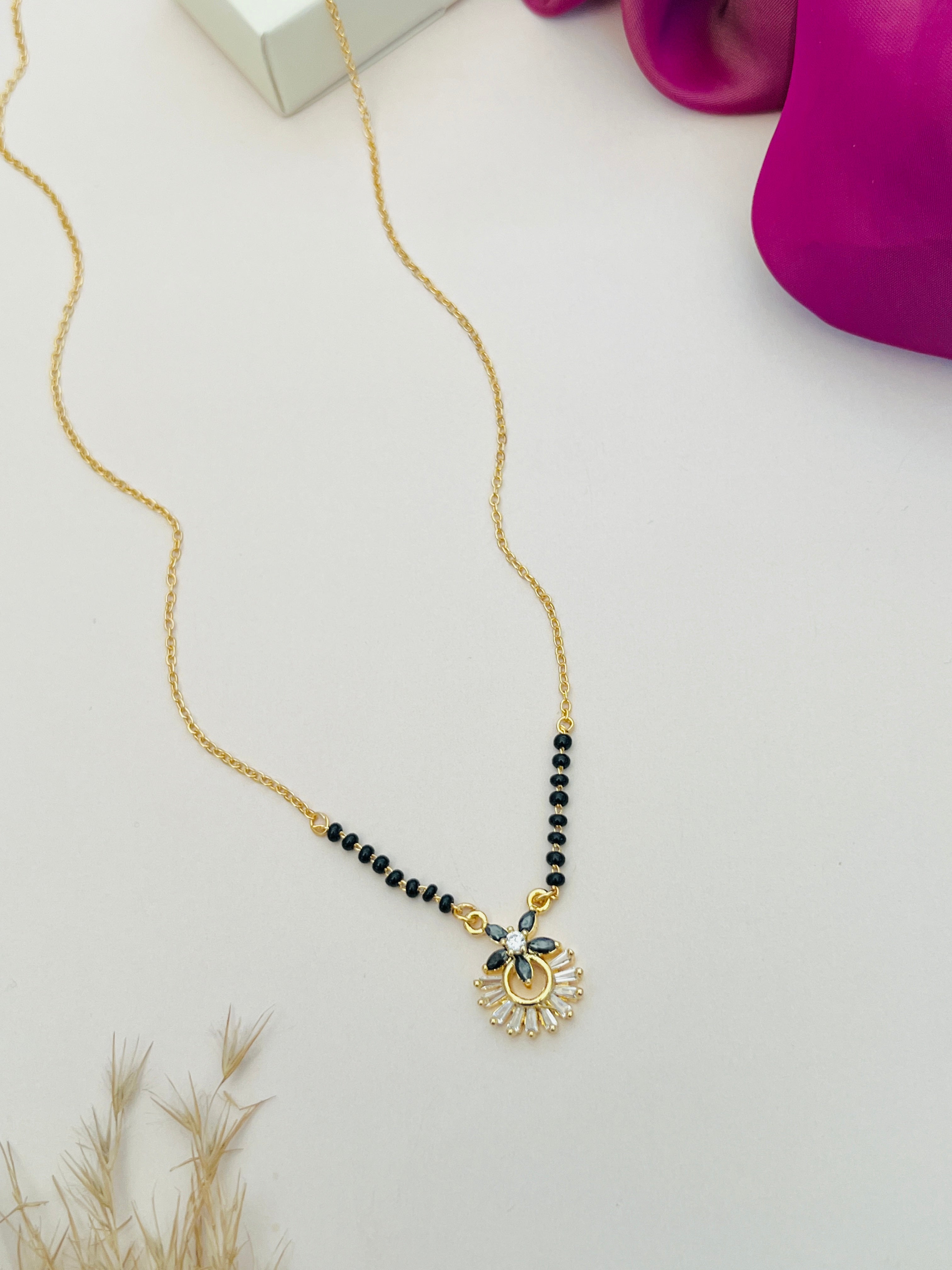 Dazzling American Diamond Mangalsutra by Abdesignsjewellery with gold chain and black beads featuring a delicate diamond pendant