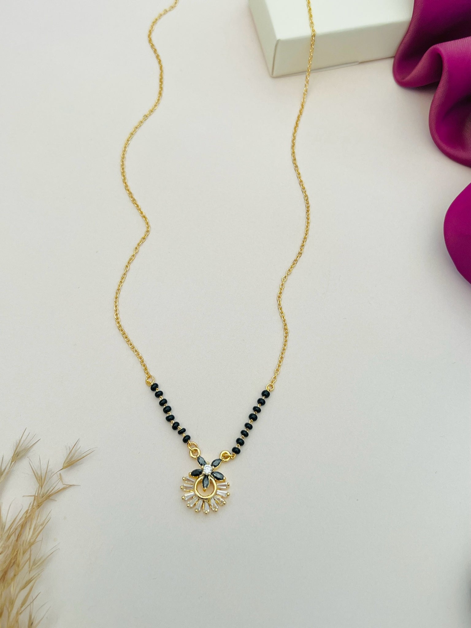 Dazzling American Diamond Mangalsutra by Abdesignsjewellery featuring black beads and gold pendant