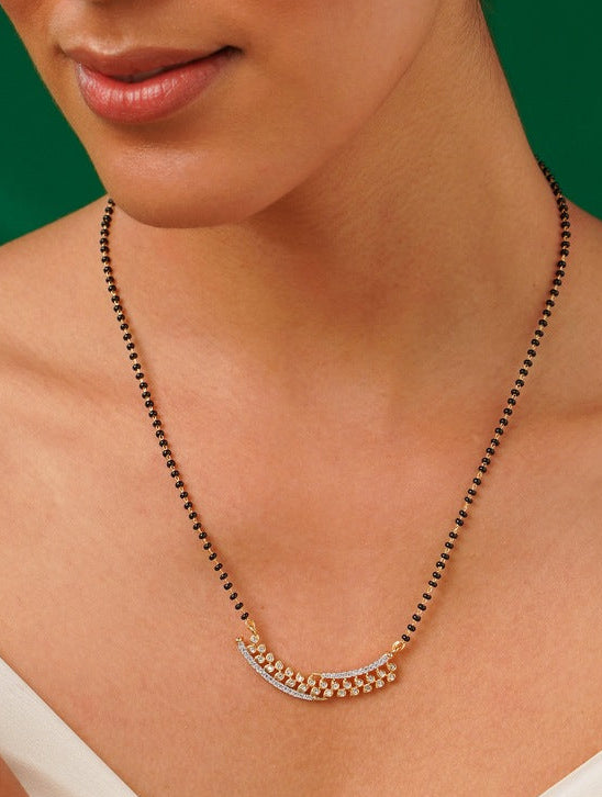 Elegant Gold Plated American Diamond Mangalsutra Set with black beads worn around neck