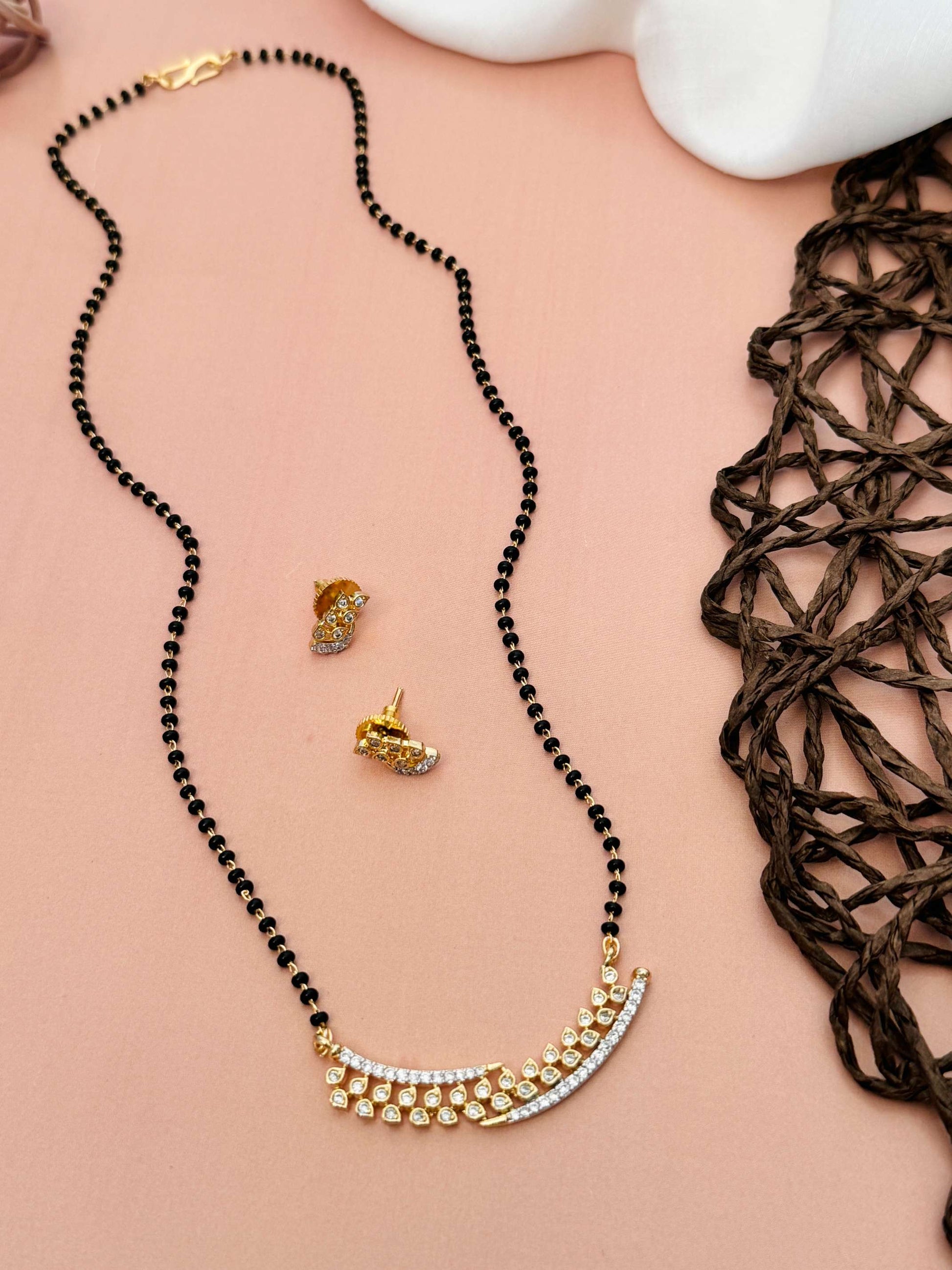Elegant Gold Plated American Diamond Mangalsutra Set by Abdesignsjewellery with black beads and matching earrings
