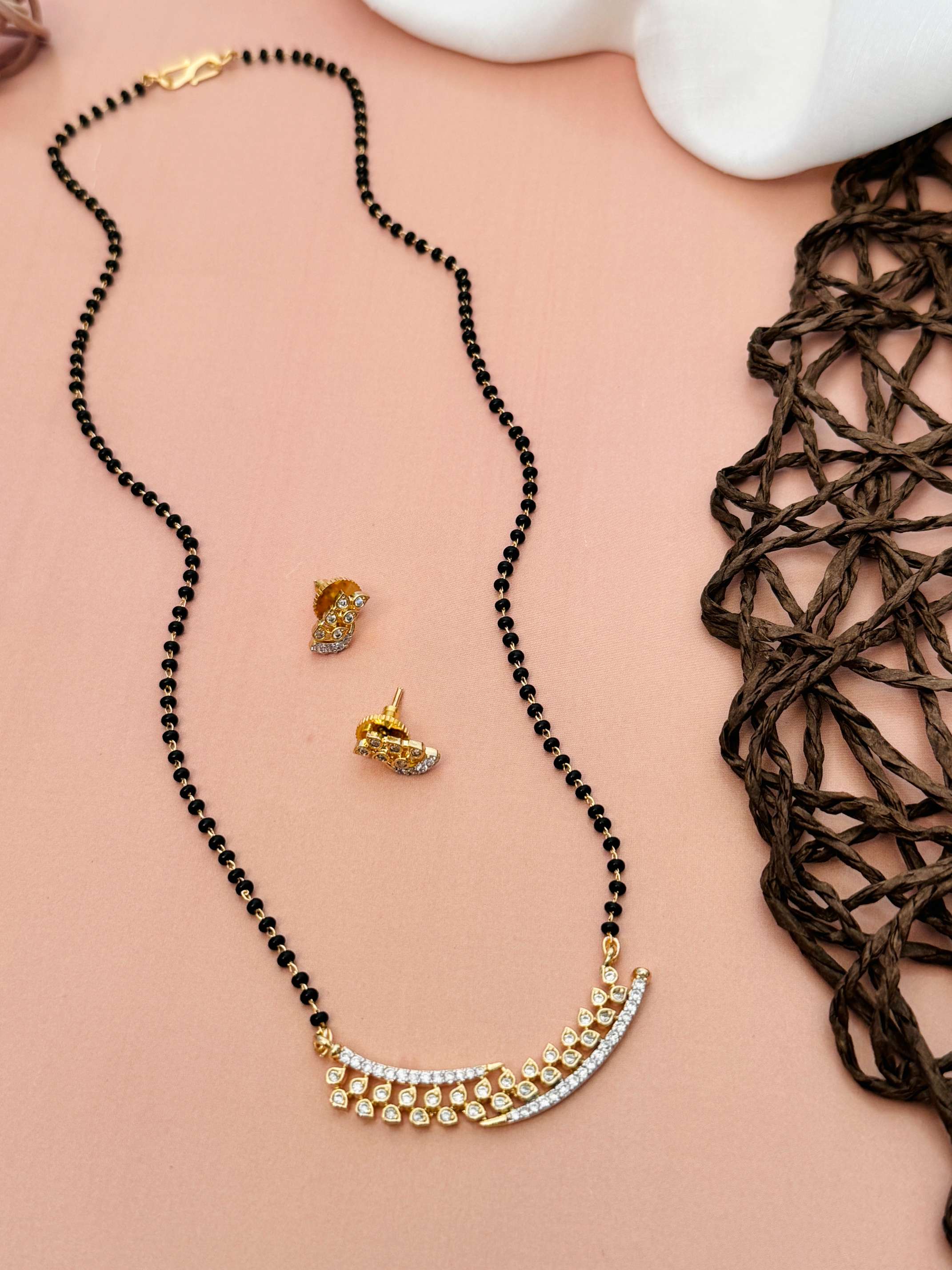 Elegant Gold Plated American Diamond Mangalsutra Set by Abdesignsjewellery with black beads and matching earrings