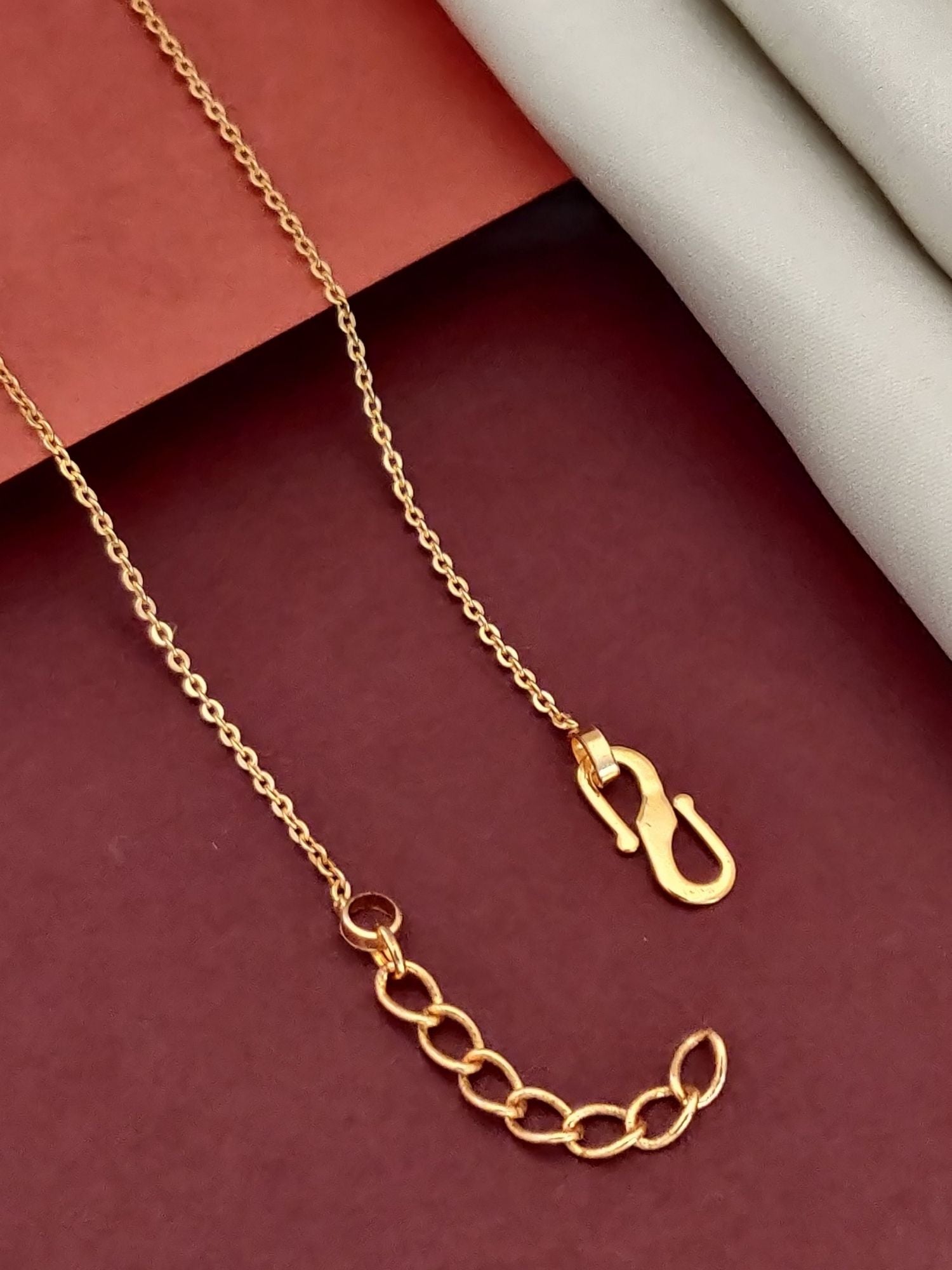Elegant gold plated pendant necklace displaying a delicate chain and stylish clasp design