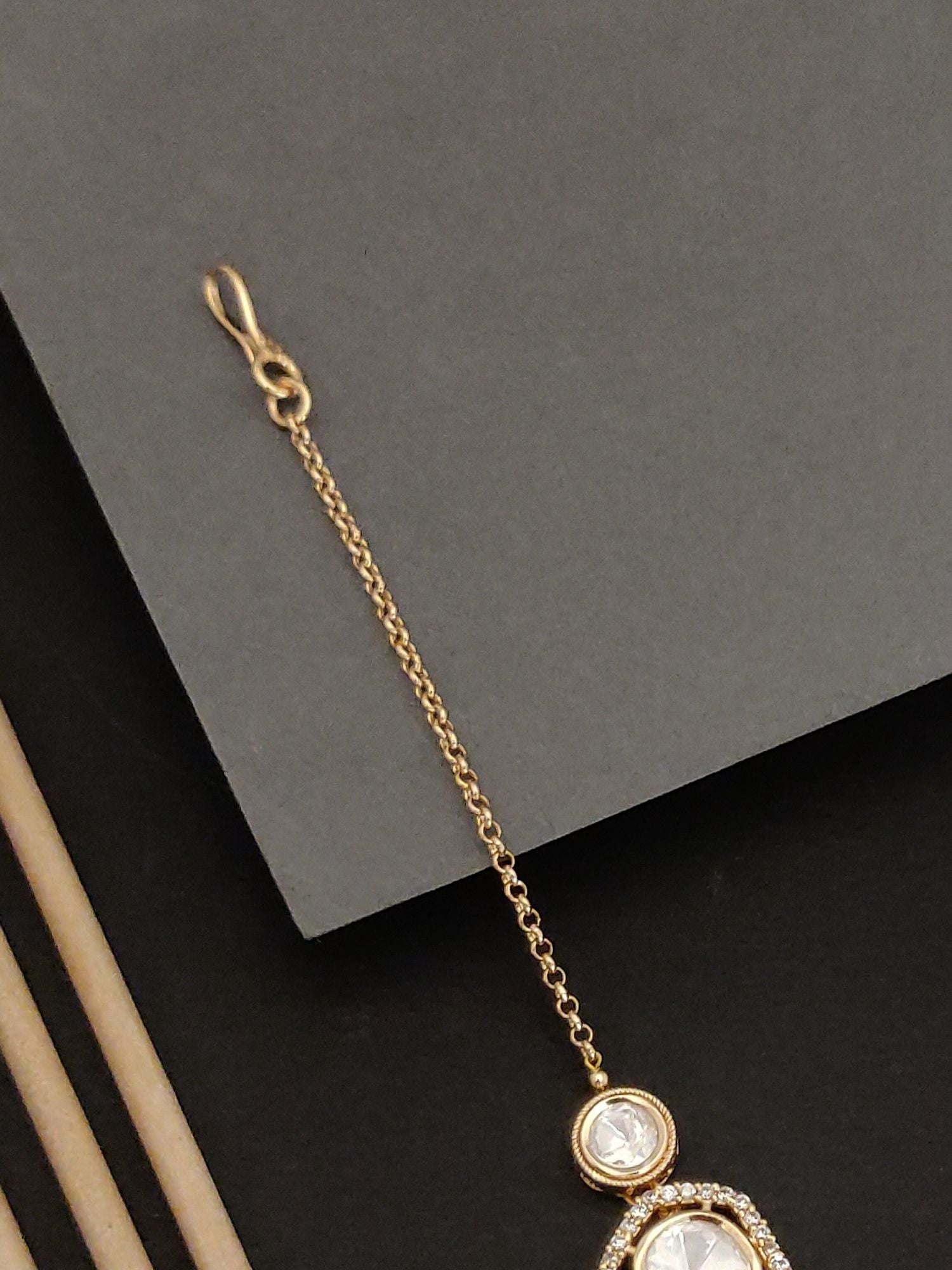 Elegant Gold plated Polki Diamond Maangtikka with intricate chain design by Abdesignsjewellery