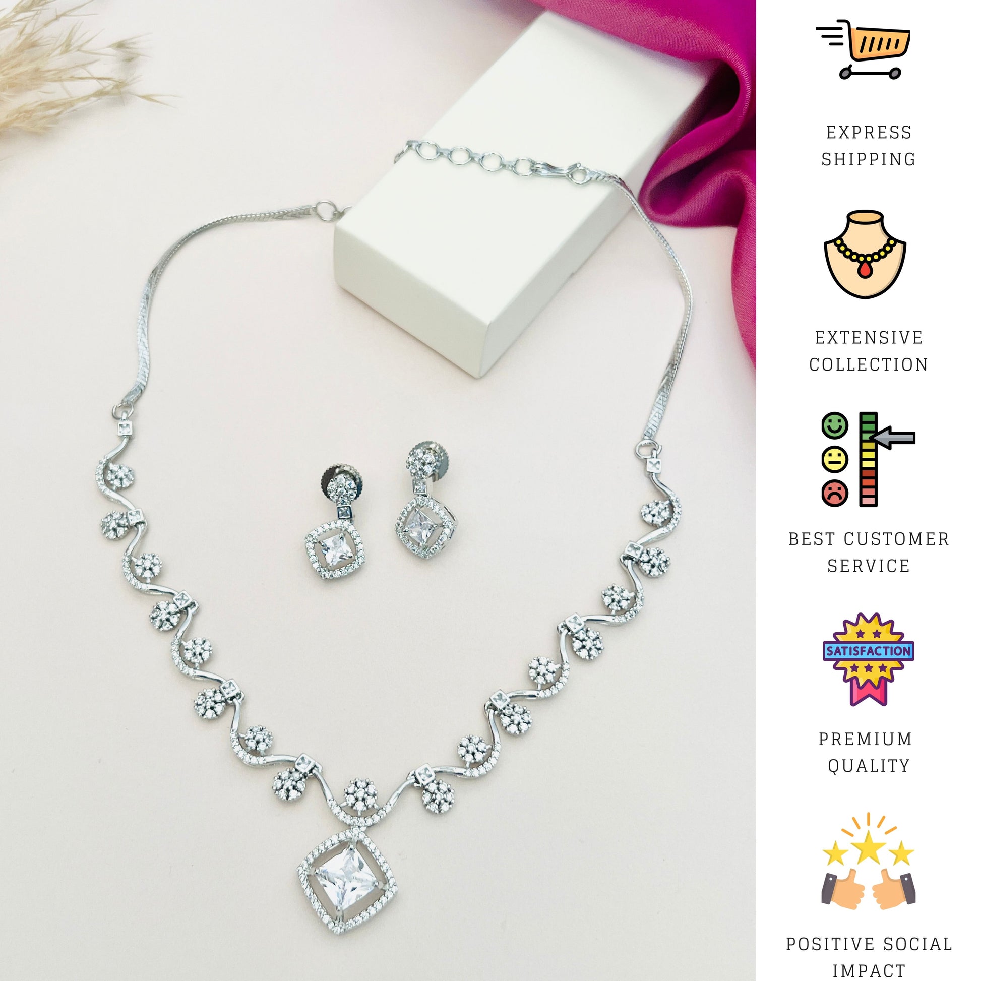 Elegant Necklace with Sparkling Stones by Abdesignsjewellery with matching earrings on white surface