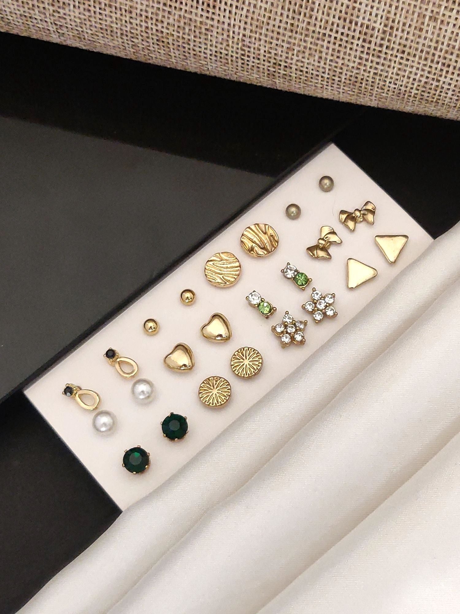 Elegant Set Of 12 Gold Plated Studs Earring Combo on display with various designs