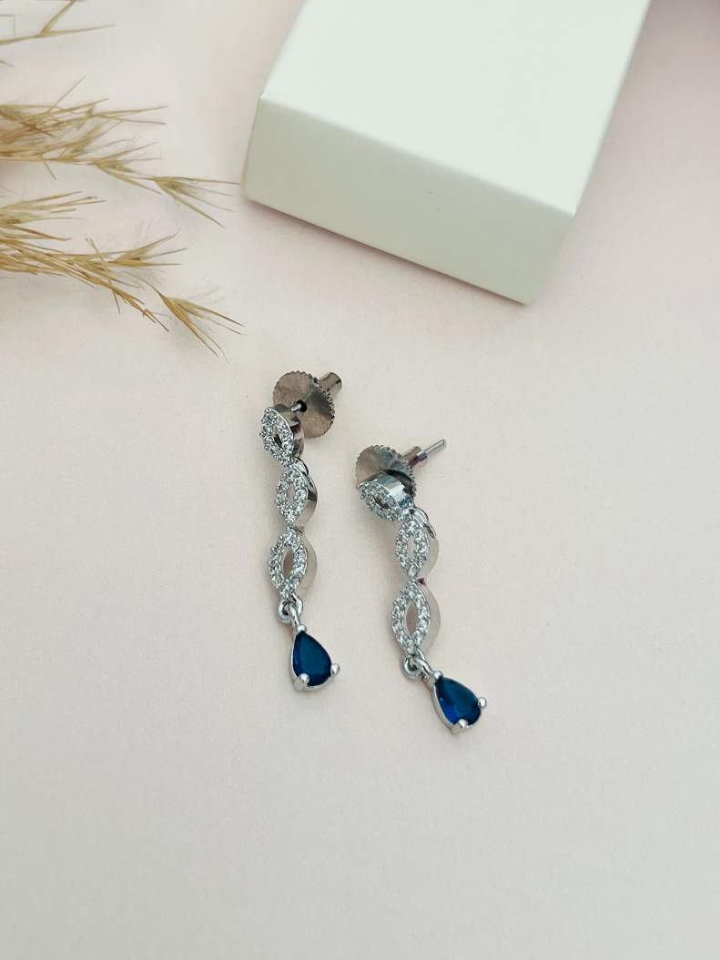 Elegant Silver Plated American Diamond Necklace Set featuring dangling earrings with blue teardrop stones