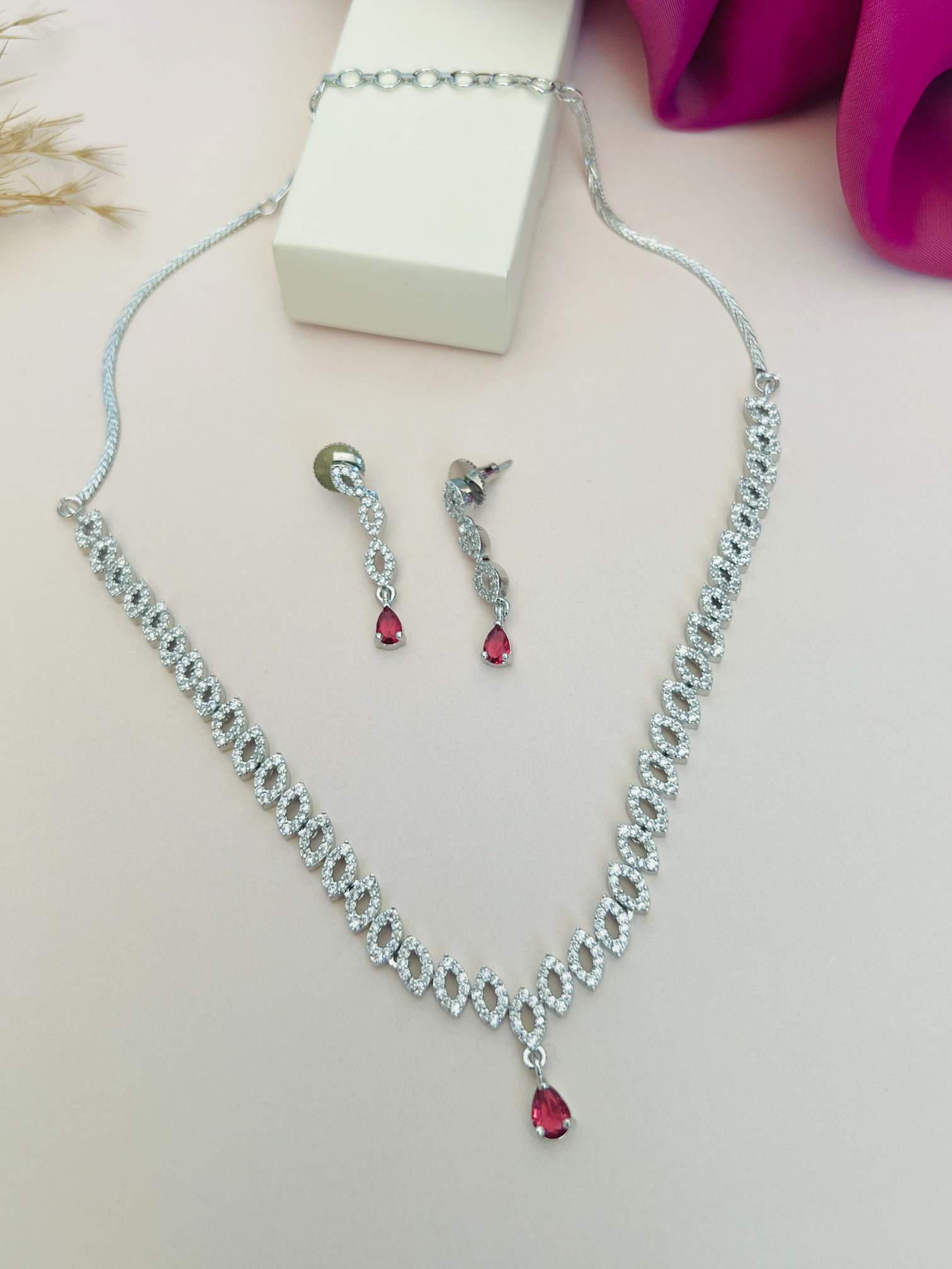 Elegant Silver Plated American Diamond Necklace Set with Matching Earrings and Red Gemstone Drops