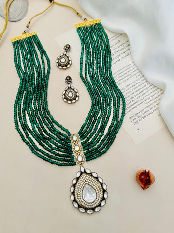 Emerald Green Polki Jaipuri Mala Set with multi-strand green beads and intricate white stone pendant with matching earrings