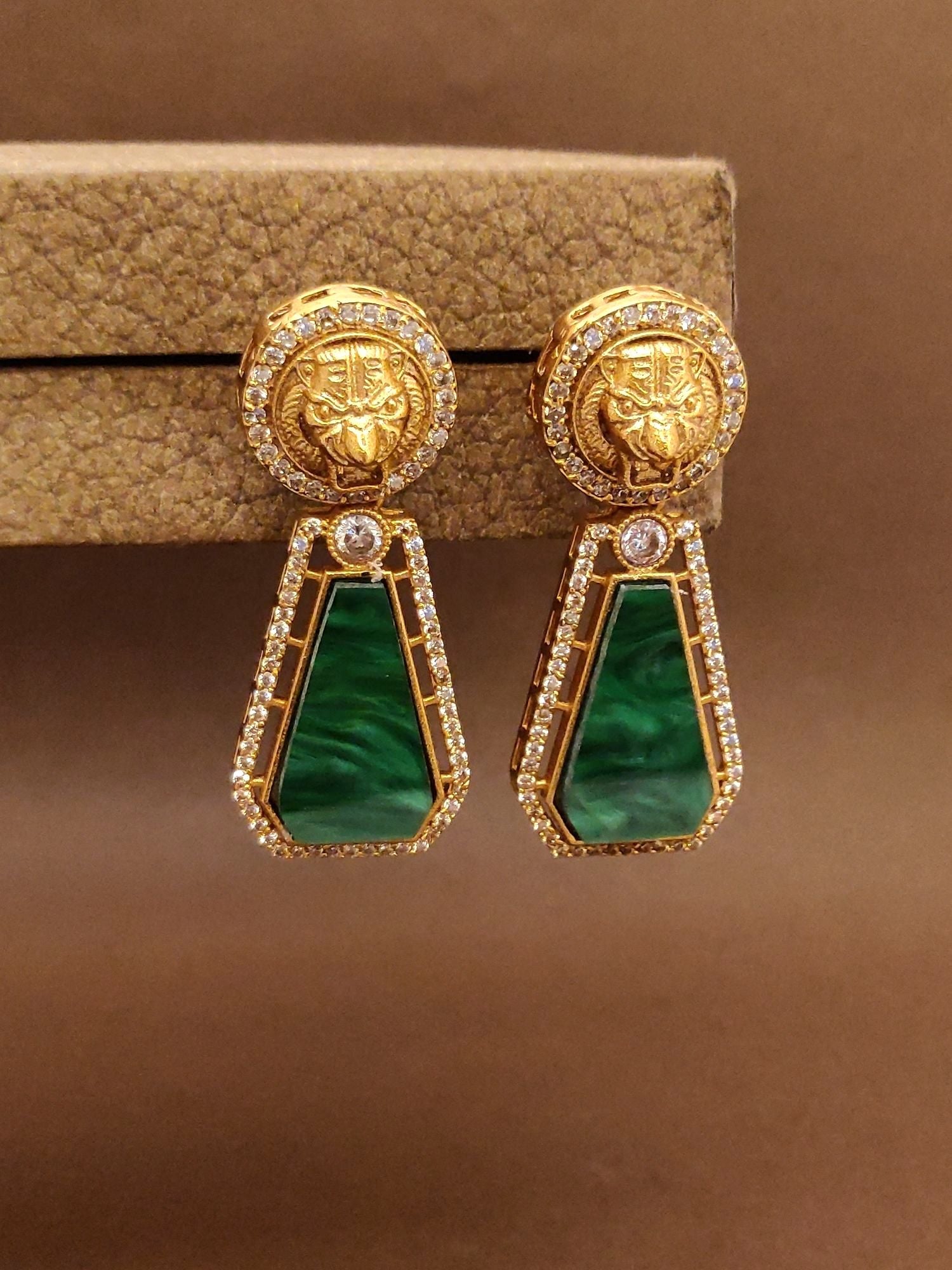 Emerald Sabyasachi Earrings with Elegant Gold Setting and Diamond Accents