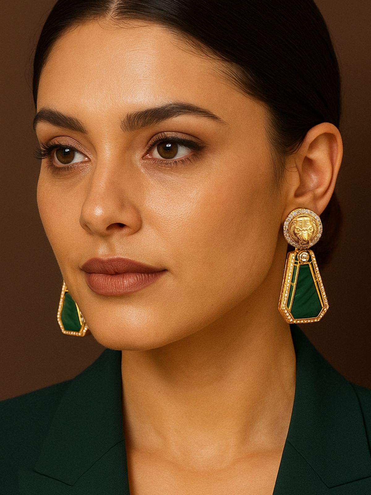 Elegant Emerald Sabyasachi Earrings with intricate gold detailing and stylish design worn by a model
