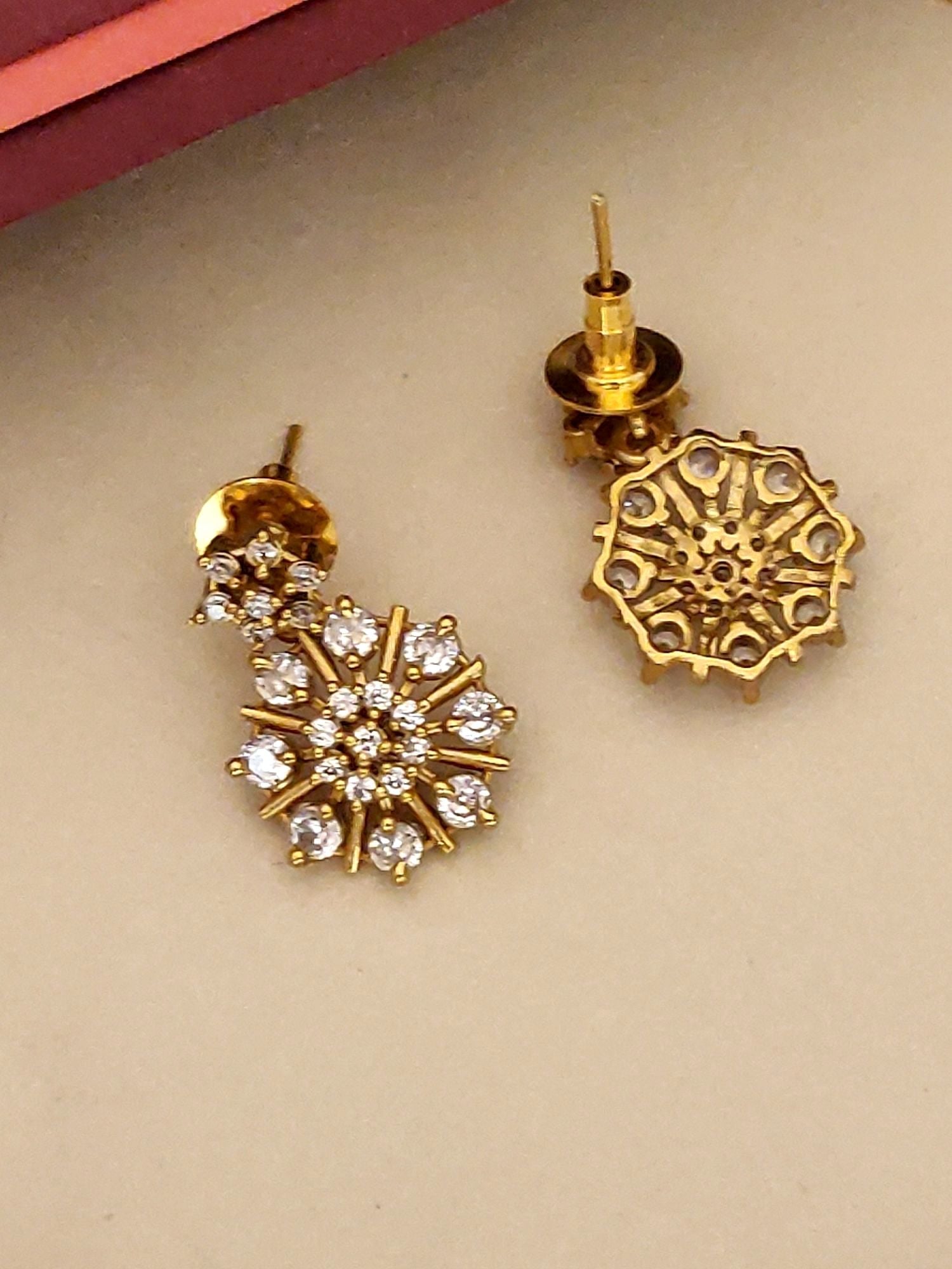 Extravagant Gold Plated American Diamond Necklace Set with intricate floral design and sparkling stones