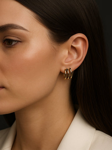 Close up of woman wearing Fancy Gold Plated Western Studs Earring triple hoop gold studs by Abdesignsjewellery